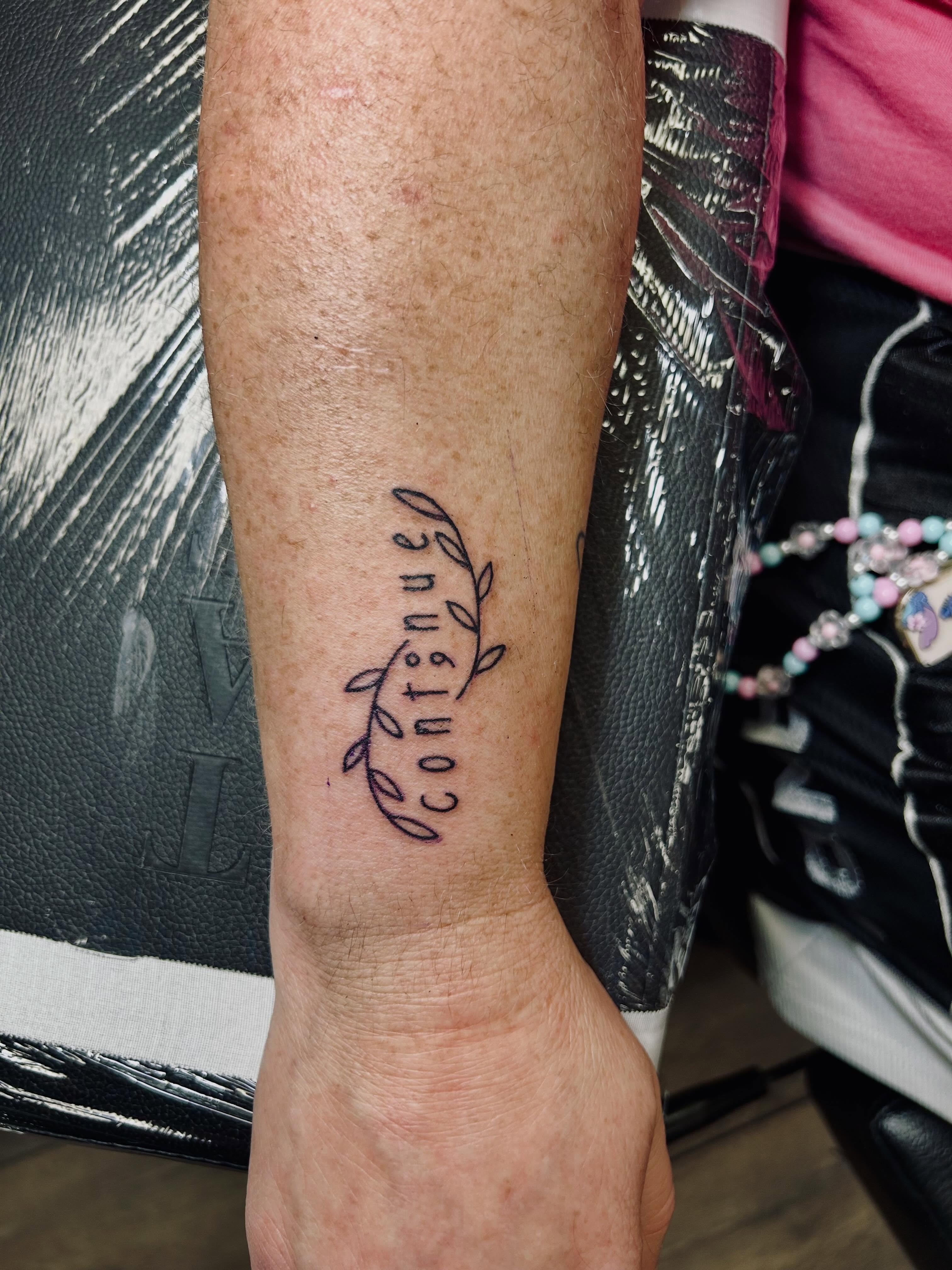 Continue fine line tattoo on the forearm by Bjorn Bjornstad, Dubuque, Iowa
