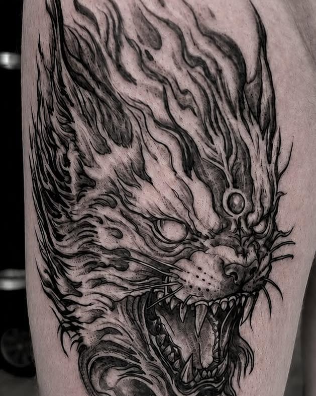 Demon head dark realism tattoo on the forearm by Léon Huiting