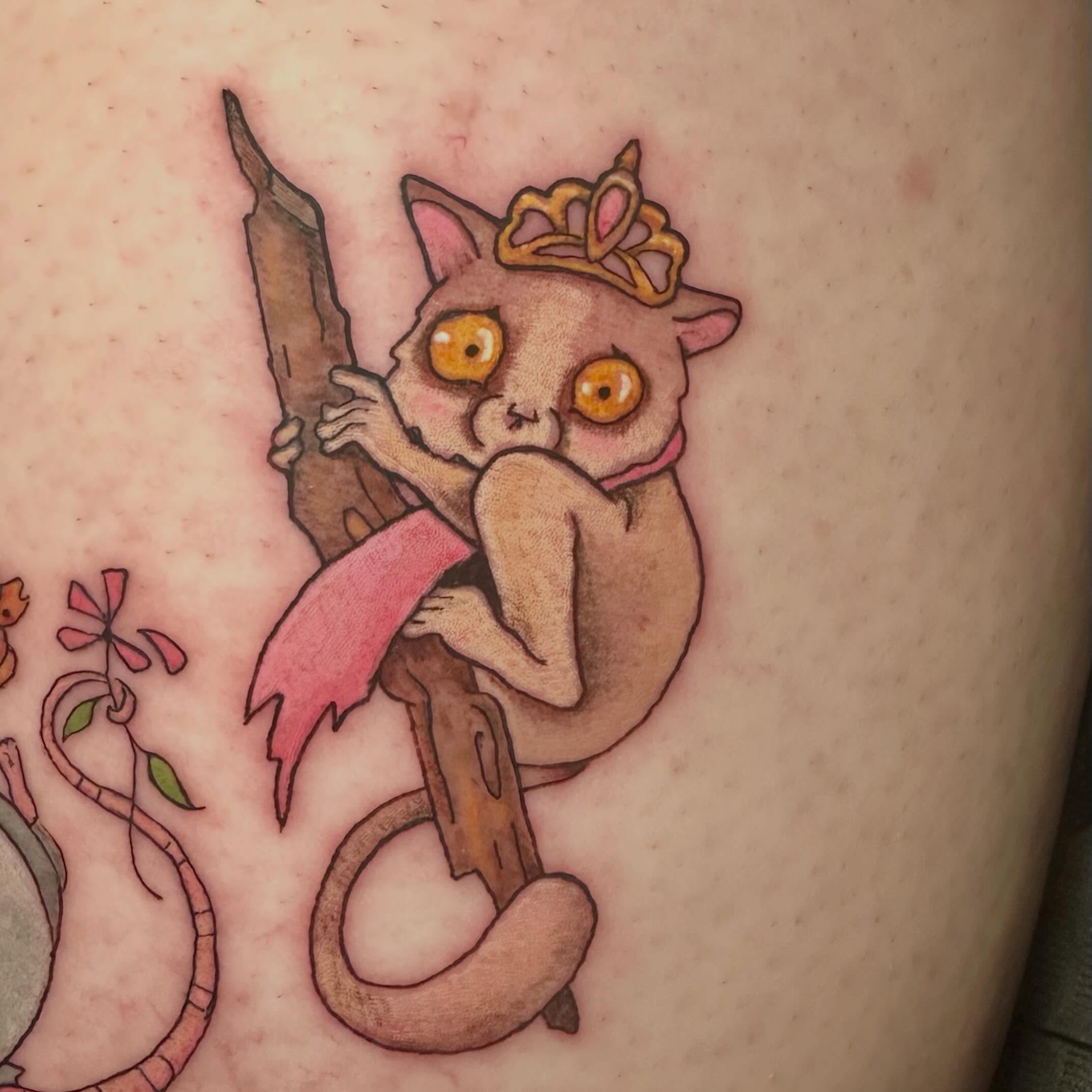 Lemur with crown new school tattoo on the thigh by Sam, Mount Laurel, New Jersey