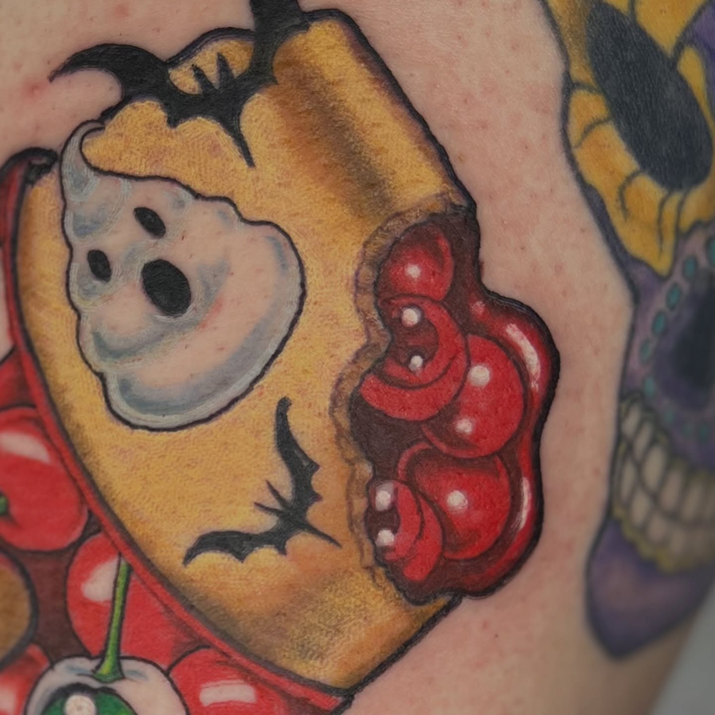 Cherry pie American traditional tattoo on the upper arm by Alex Santaloci