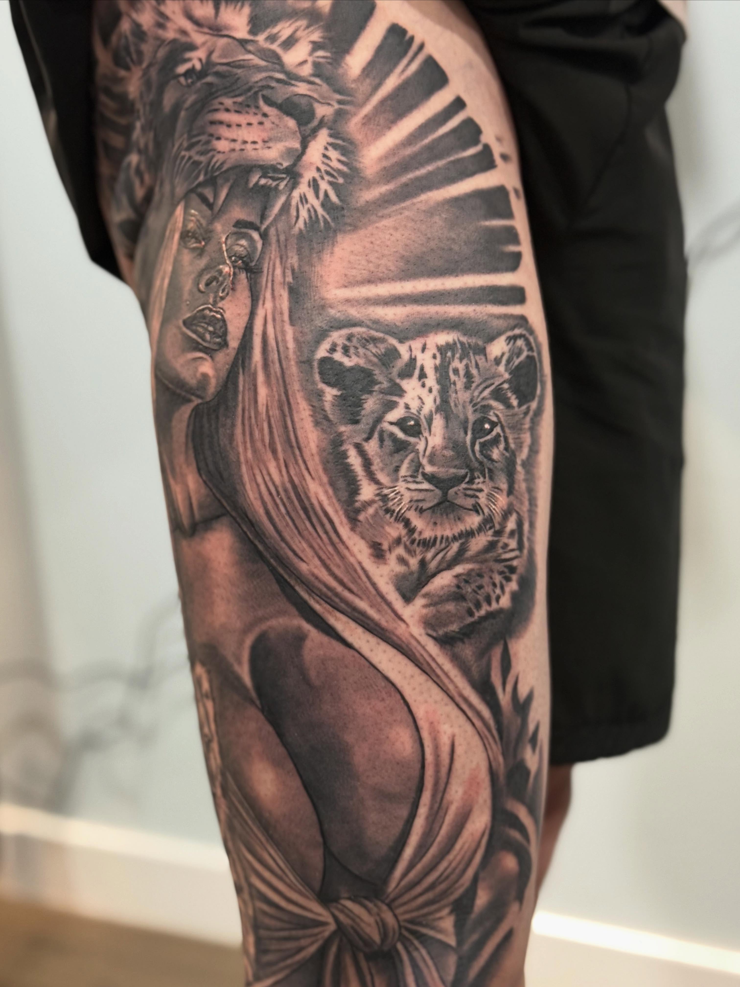 Lion and cub realism tattoo on the forearm by Joseph Pacheco