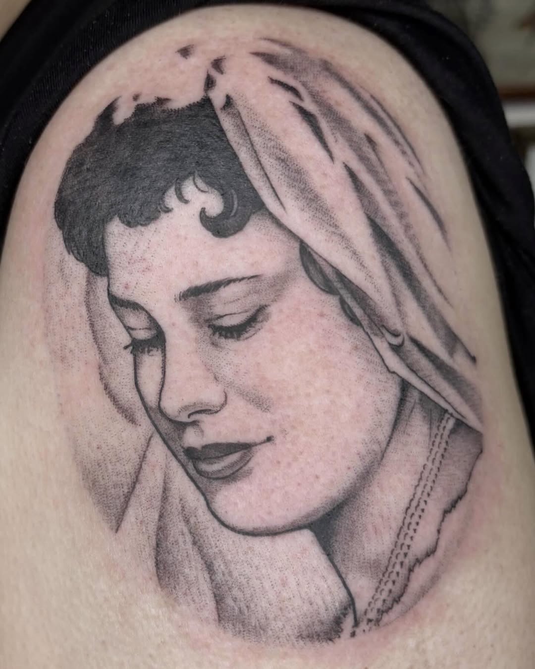 Woman's face with veil Chicano tattoo on the shoulder by Amelia Rose, Los Angeles, California