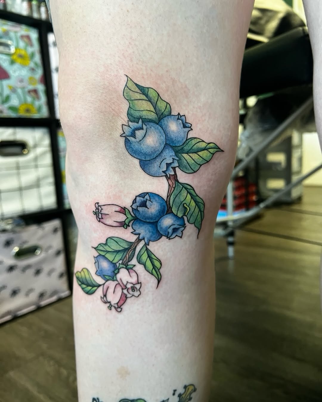 Blueberry branch with flowers American traditional tattoo on the forearm by Cortnie, Nashville, Tennessee