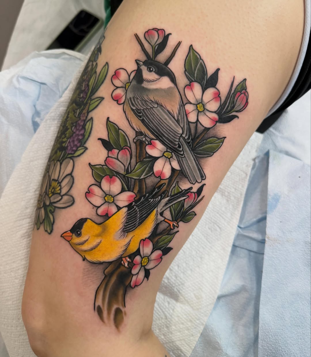 Birds and flowers American traditional tattoo on the forearm by Kyle Behr