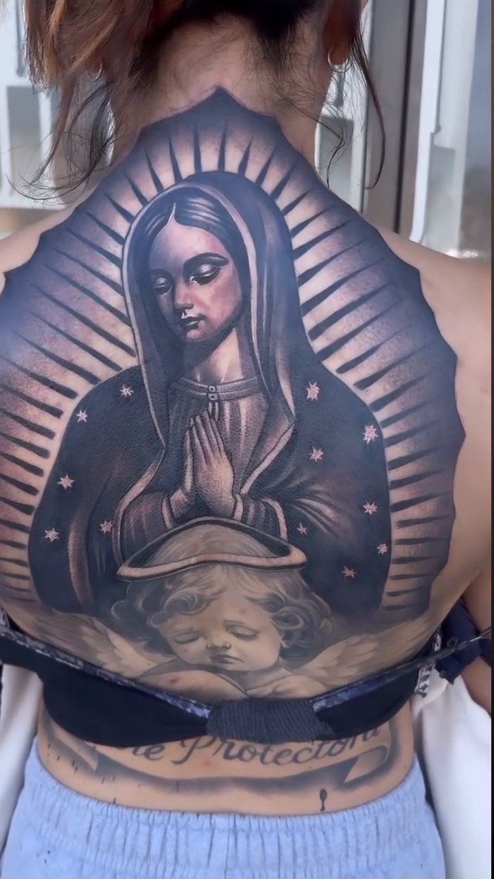Virgin Mary with cherub realism tattoo by Tattoo