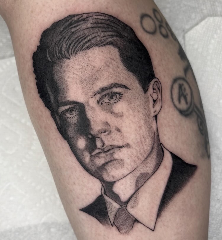 Portrait of a man realism tattoo on the forearm by Amelia Rose, Los Angeles, California