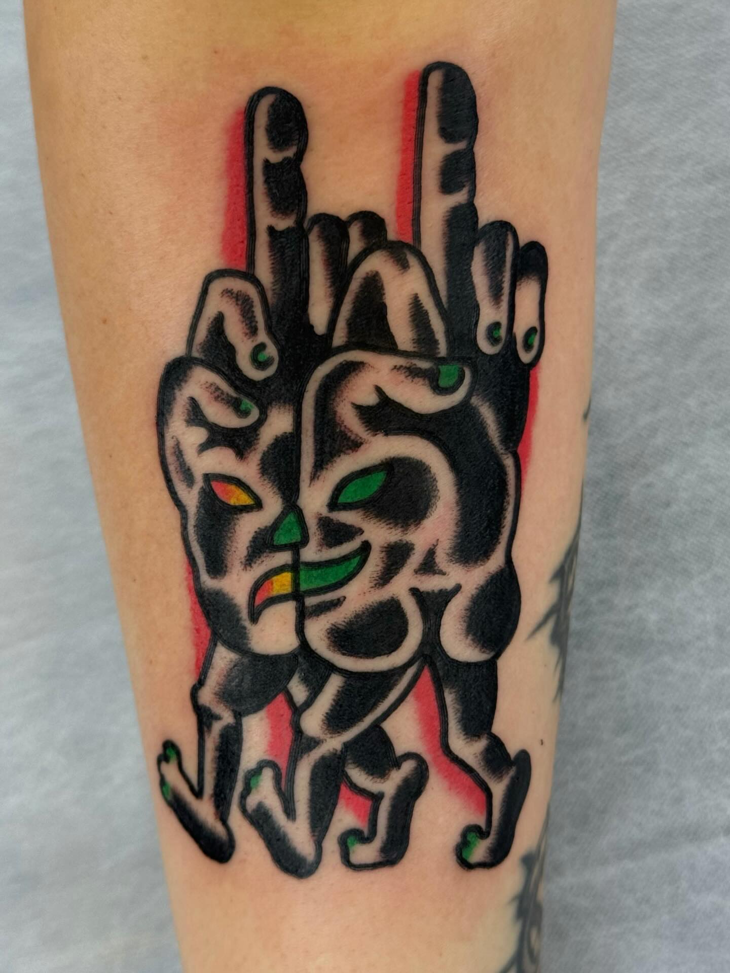 Rock sign American traditional tattoo on the forearm by JAX