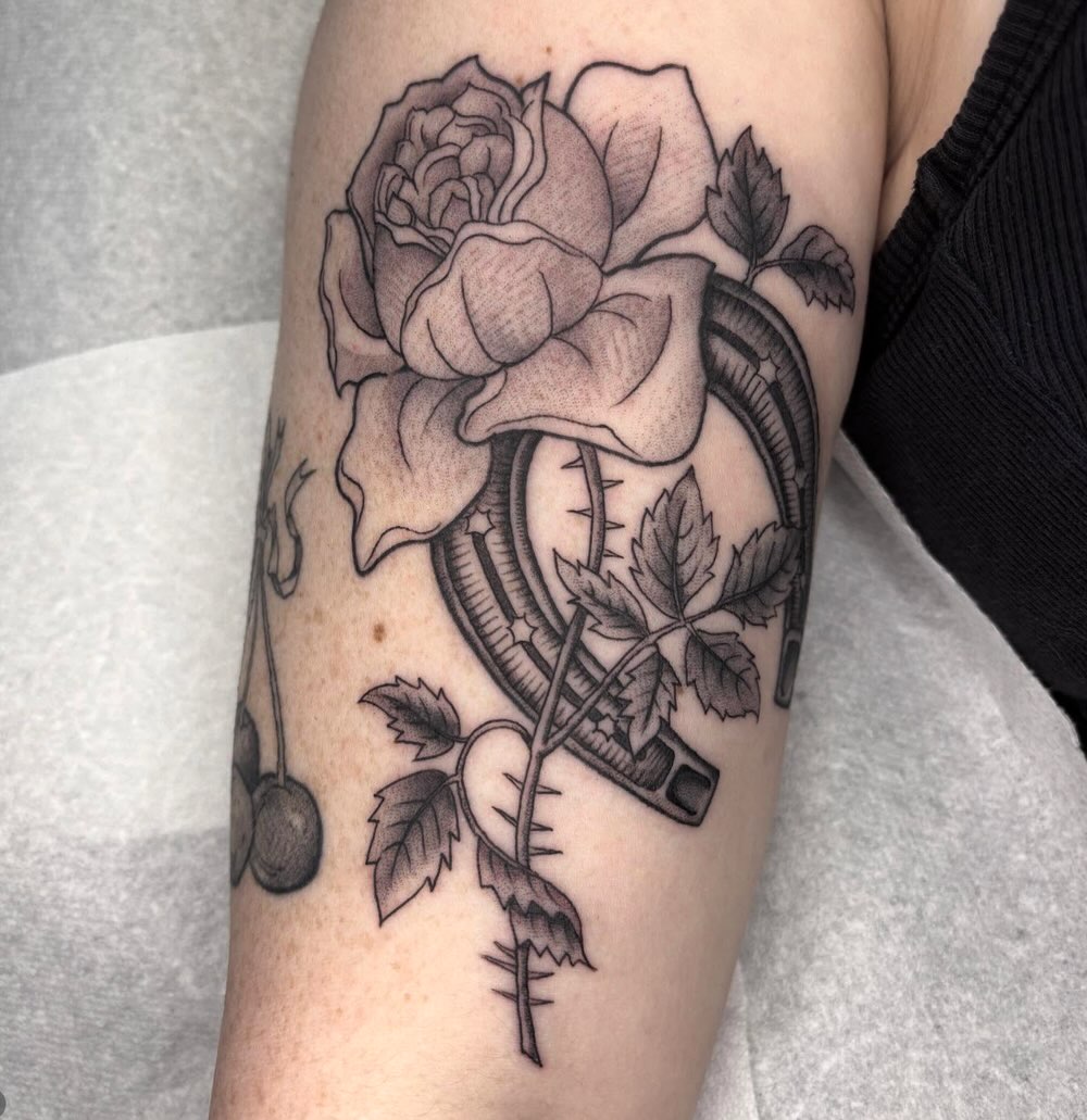 Rose and horseshoe sketch tattoo on the forearm by Amelia Rose, Los Angeles, California