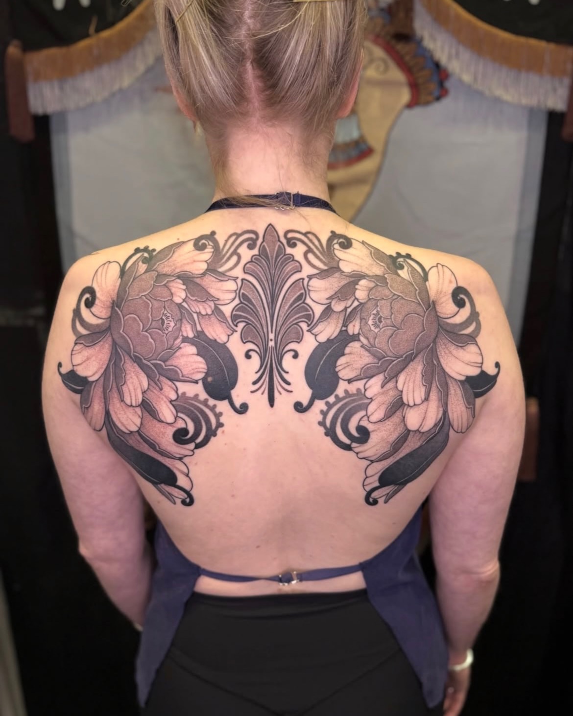 Floral ornamental tattoo on the back by Jena Perry