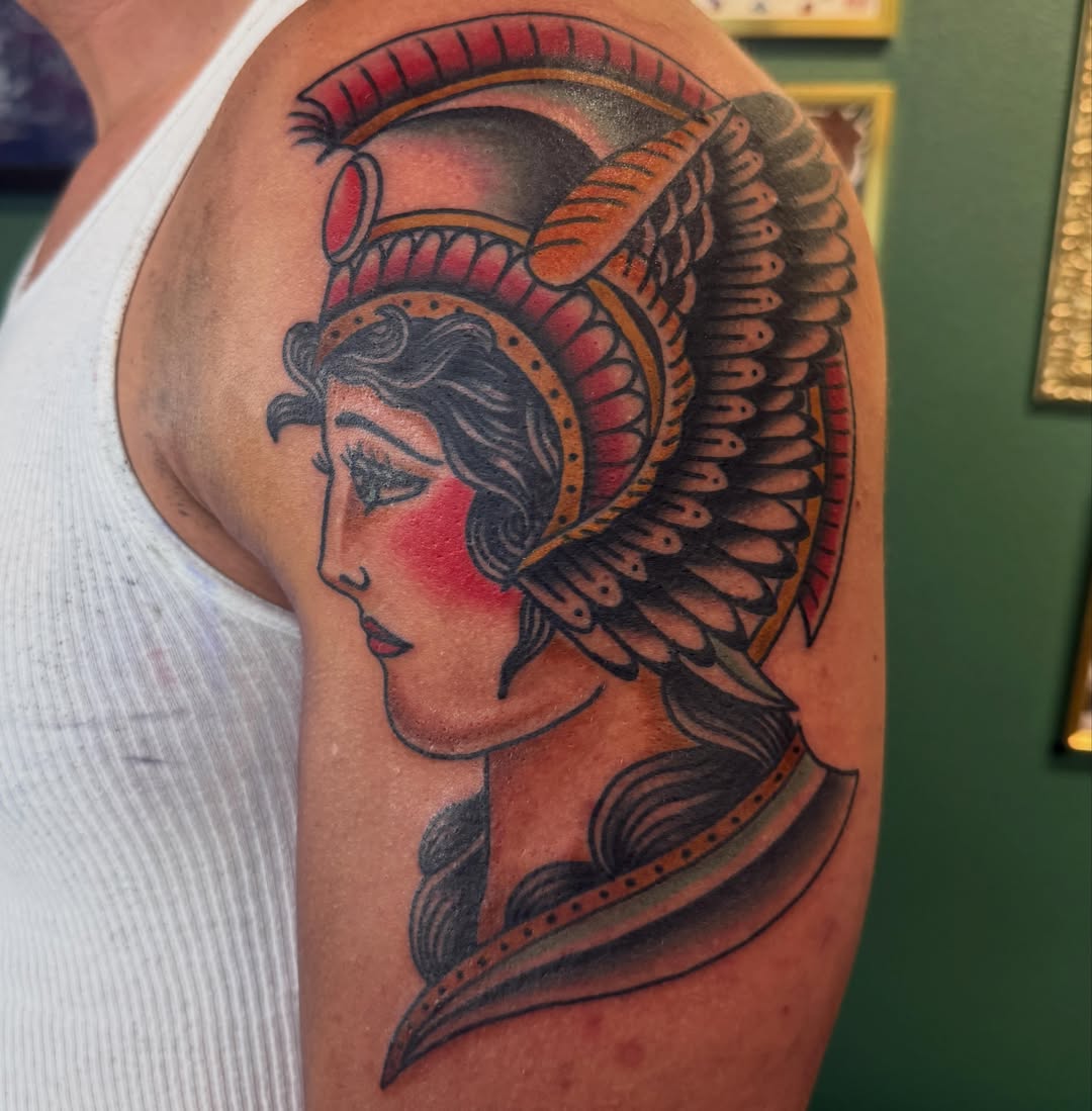 Woman with headdress American traditional tattoo on the shoulder by Ryan Moraski, Colorado Springs, Colorado