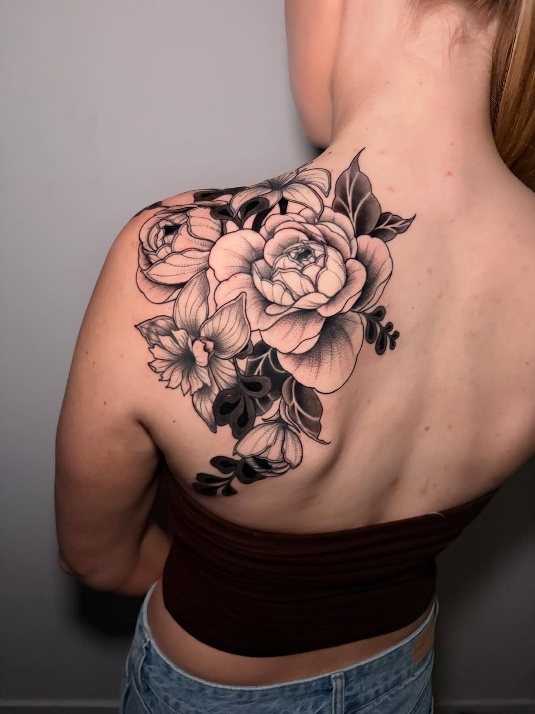 Floral arrangement dotwork tattoo on the shoulder by Kenzie Mecham-Cunningham