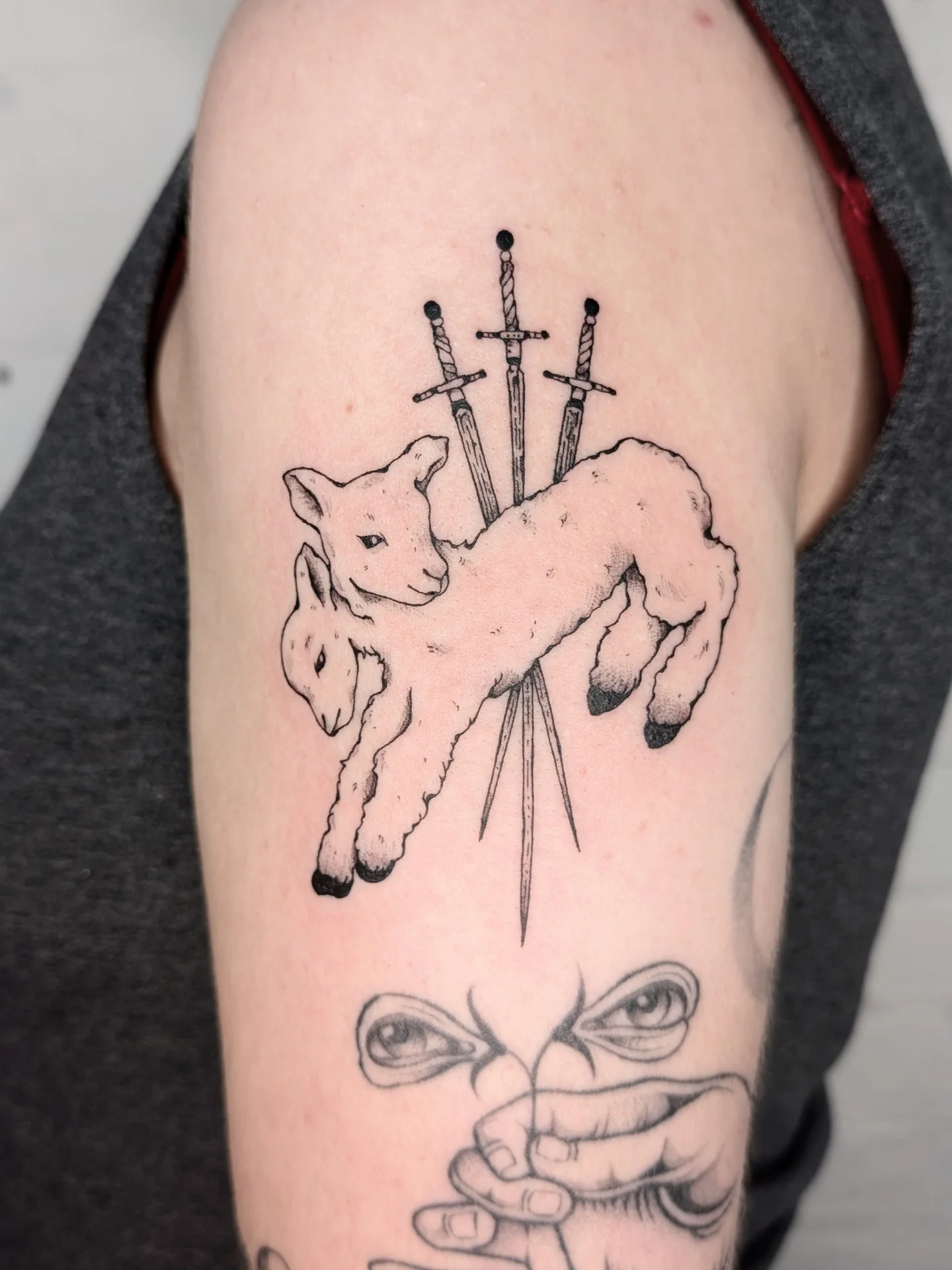 Lamb and swords black and grey tattoo on the forearm by mila