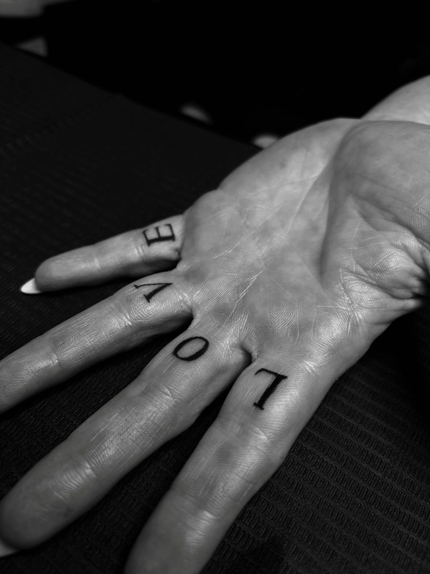 LOVE lettering script tattoo on the hand by ⚜️Embodied Tattoo⚜️, Columbus, Ohio
