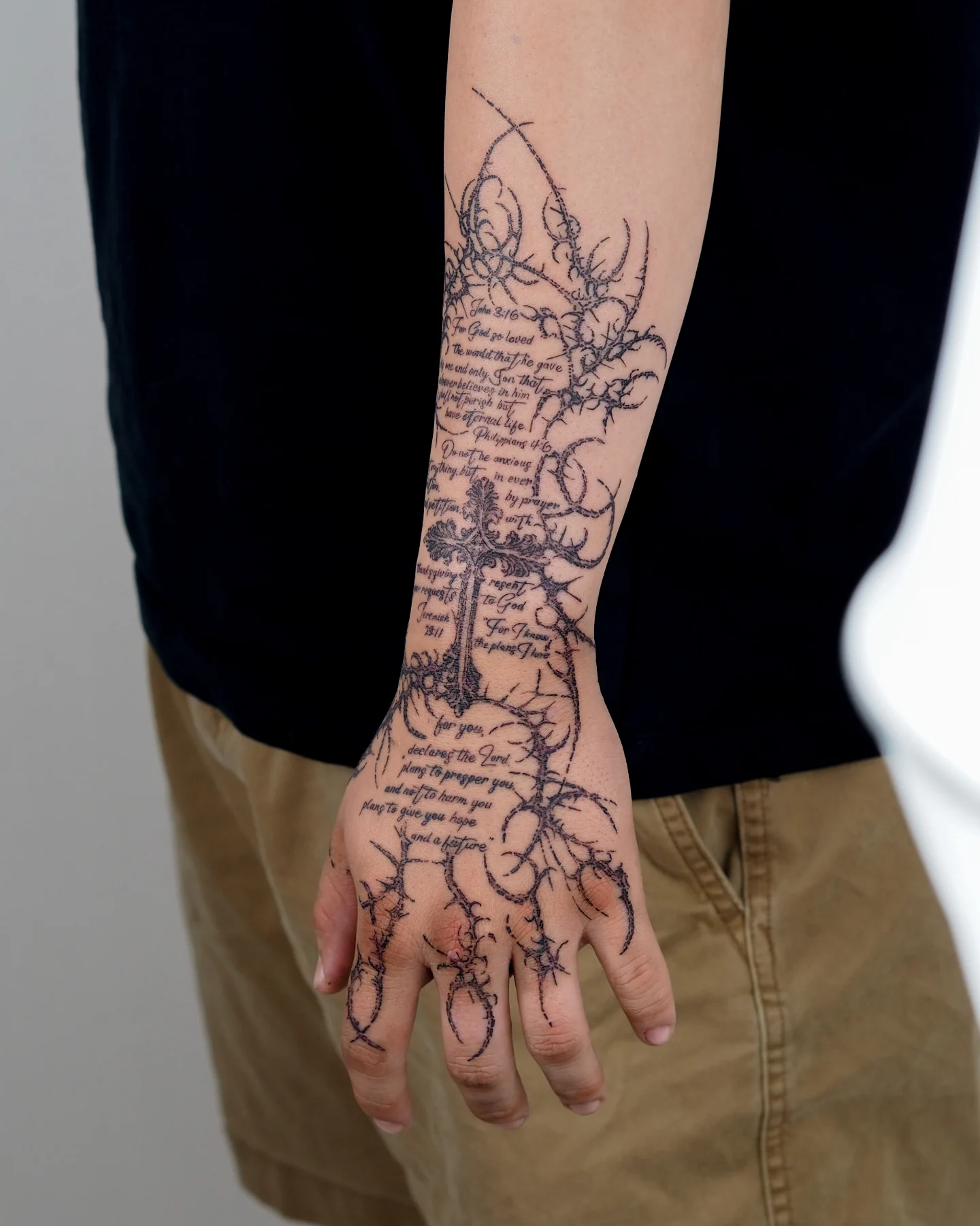 Cross and thorns black and grey tattoo on the forearm by MK