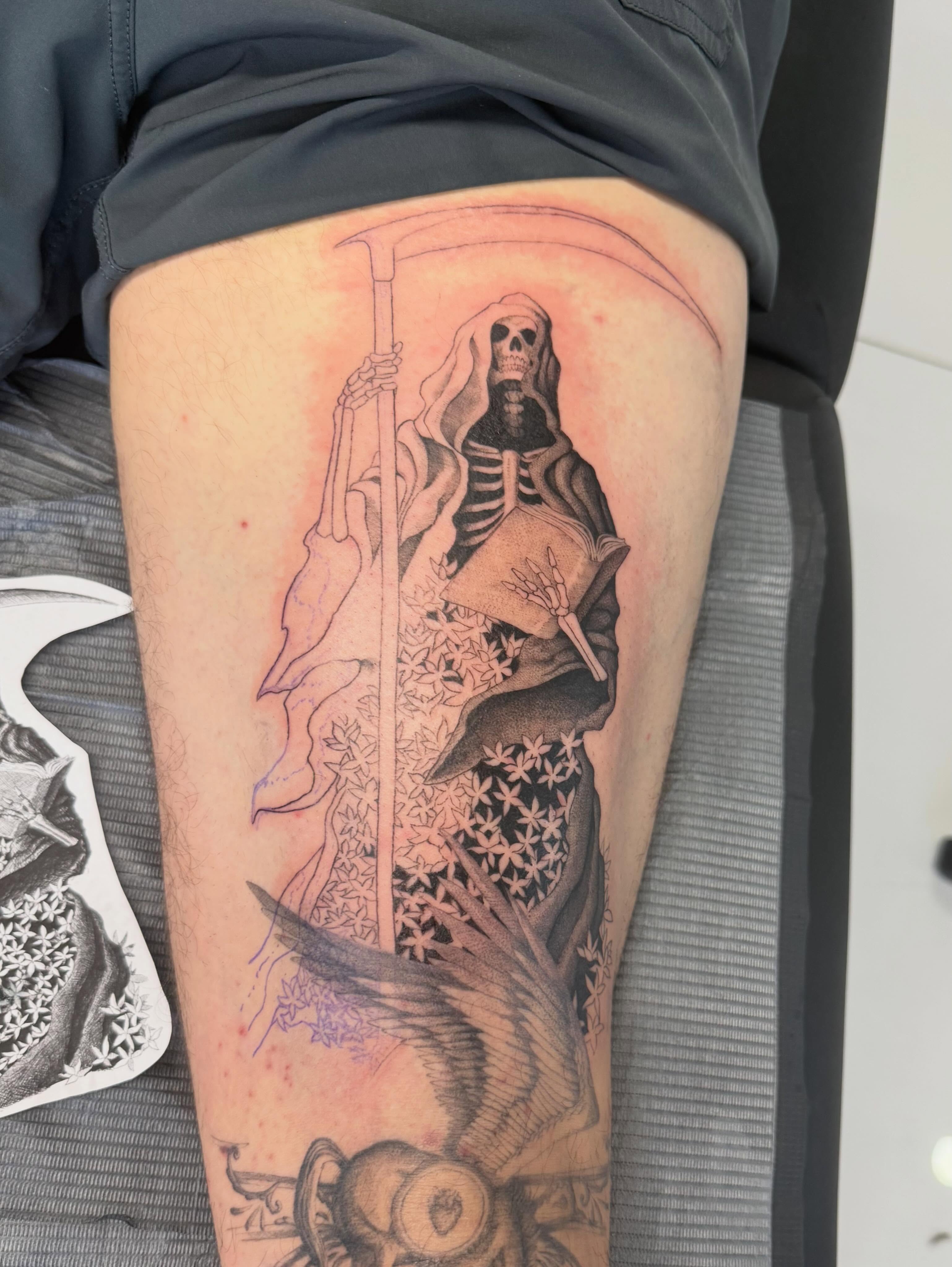 Reaper black and grey tattoo on the thigh by Andrew Flatts