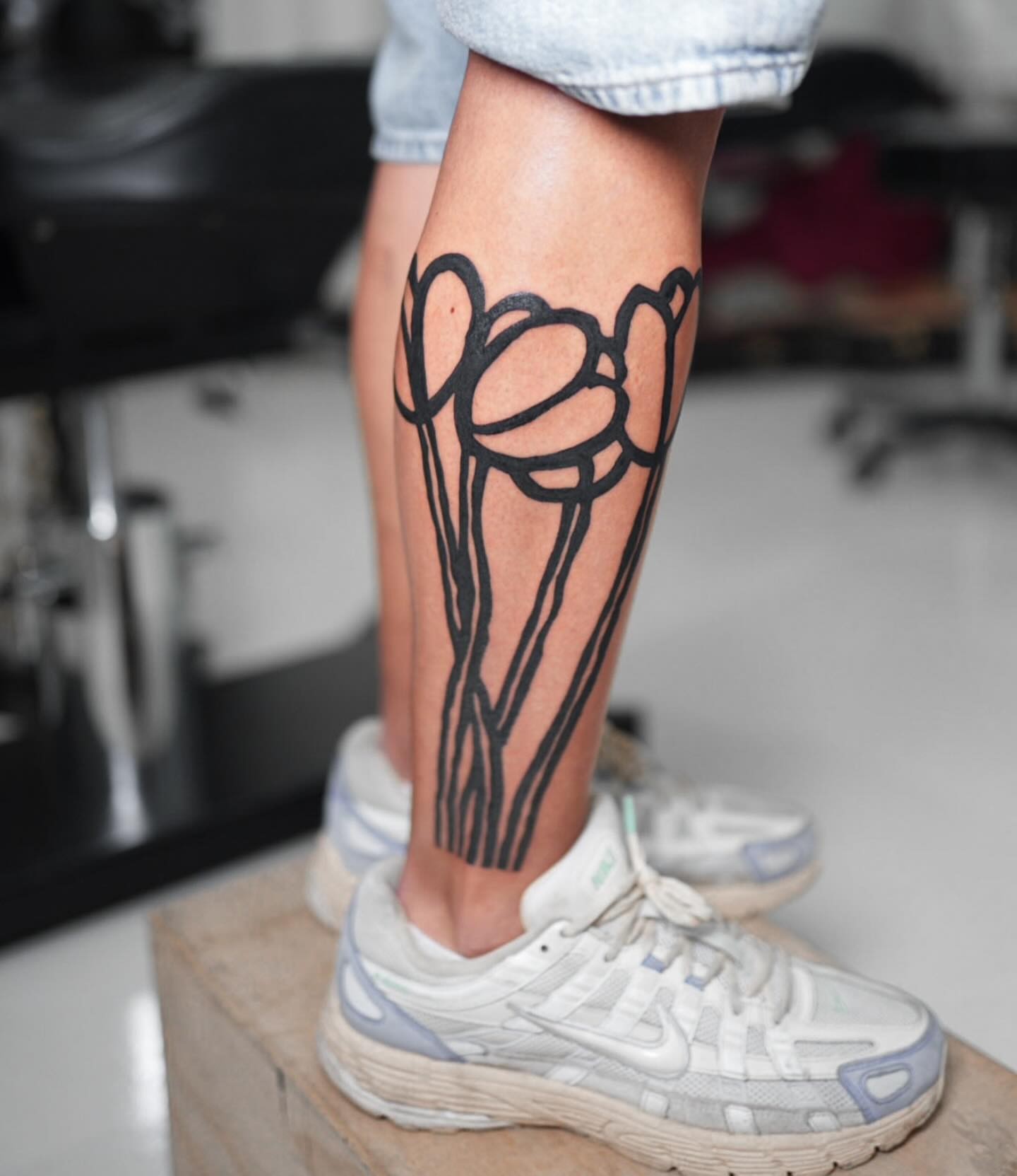 Tulips black and grey tattoo on the calf by ππππππ