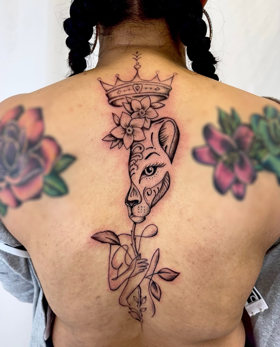 Lioness with crown realism tattoo on the back by Jerry Thomas