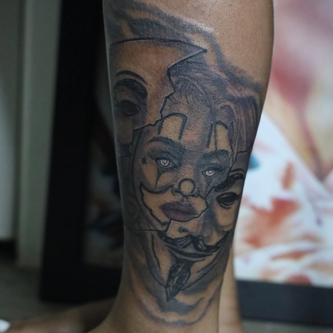 Clown face black and grey tattoo on the forearm by D. Davis