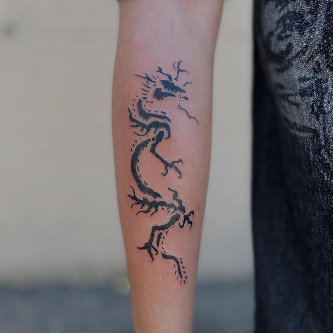 Dragon blackwork tattoo on the forearm by Christien Xavier Alba, Salt Lake City, Utah