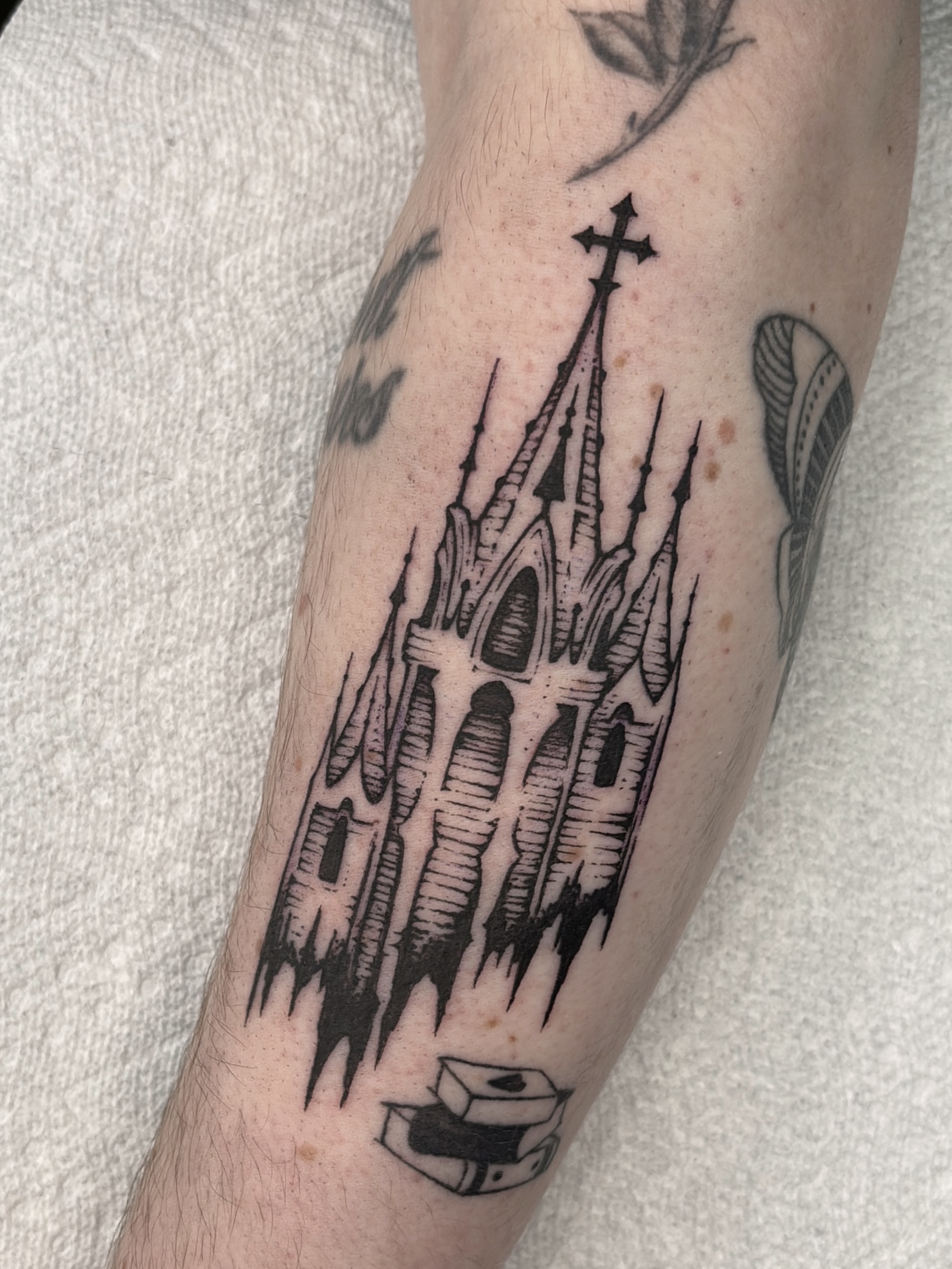 Gothic cathedral black and grey tattoo on the forearm by Harlee Hornsby