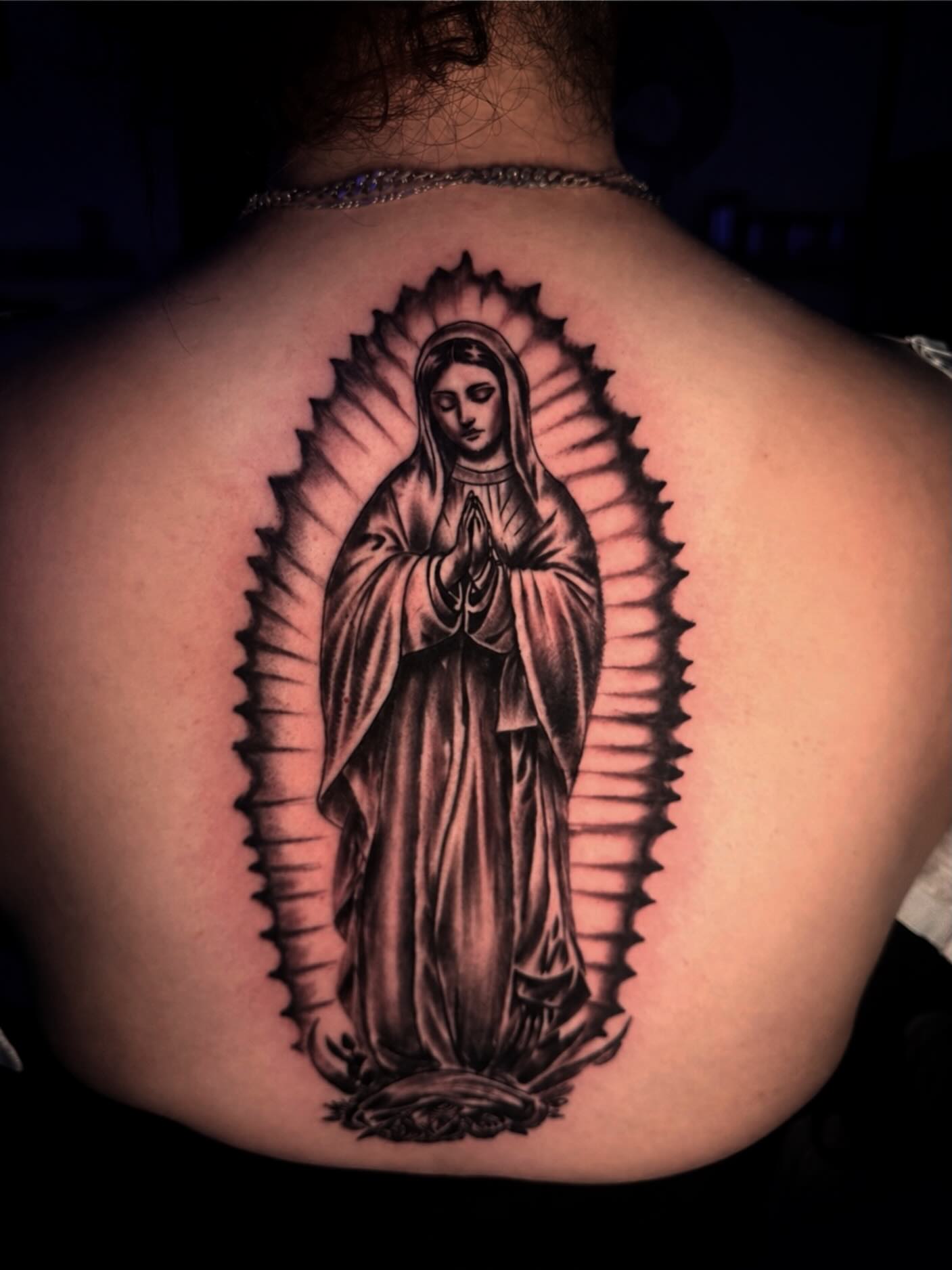 Our Lady of Guadalupe black and grey tattoo on the back by LeLe
