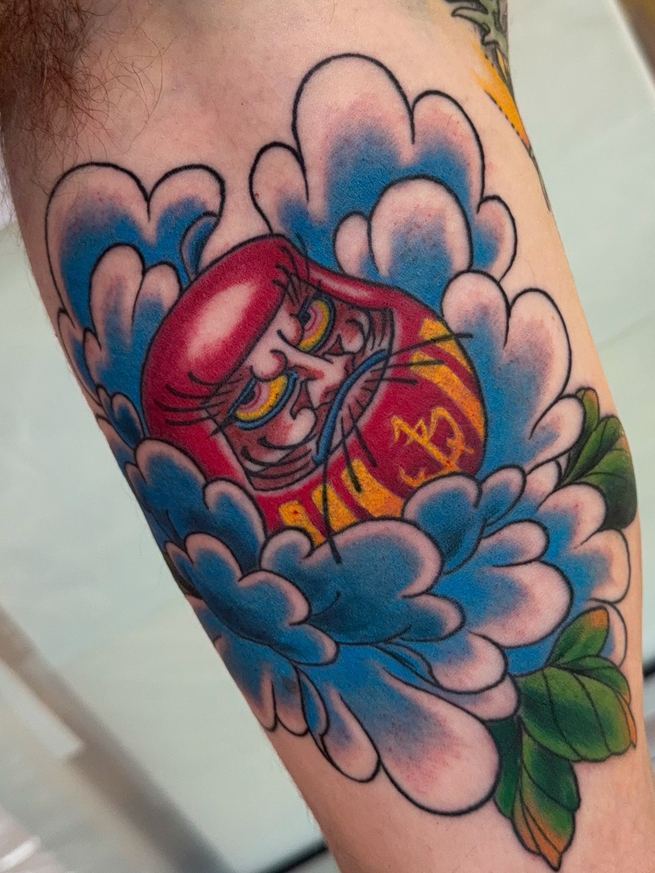 Japanese character in clouds American traditional tattoo on the forearm by James Bird, Vancouver, British Columbia