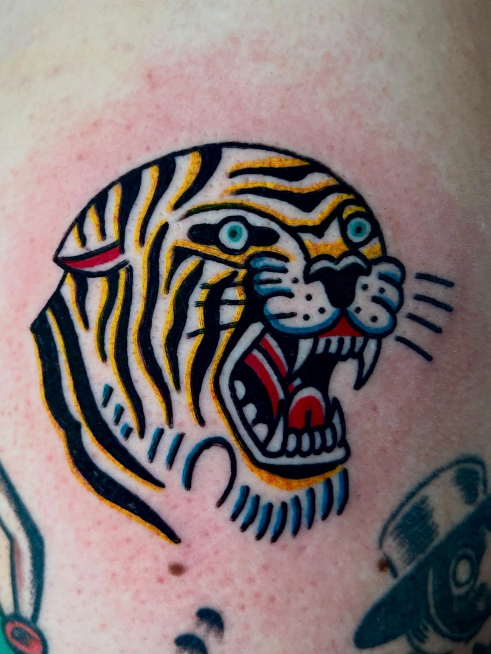 Tiger American traditional tattoo on the chest by Jesse Boss, Nashville, Tennessee