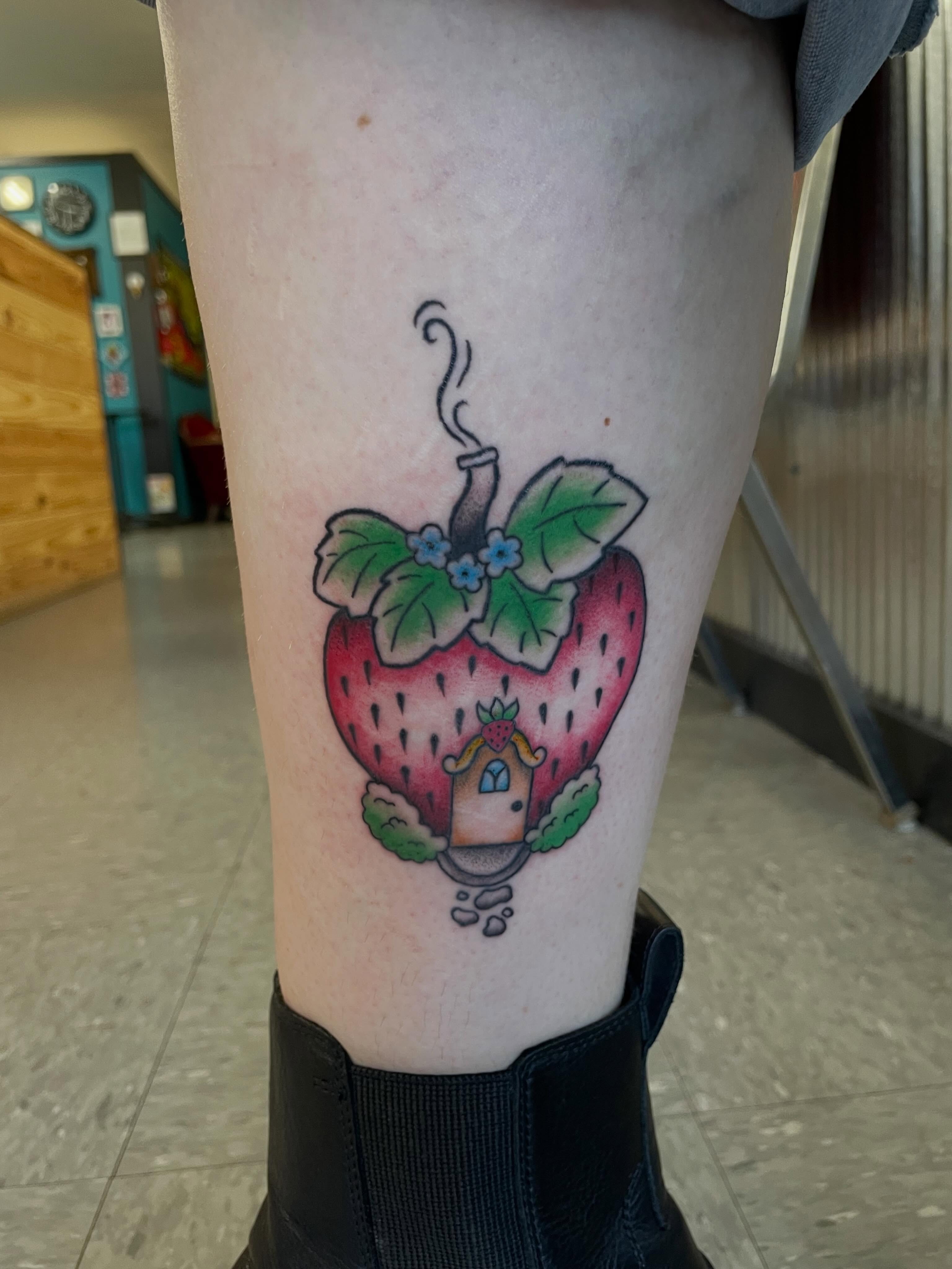 Strawberry house new school tattoo on the thigh by Mallory Moore