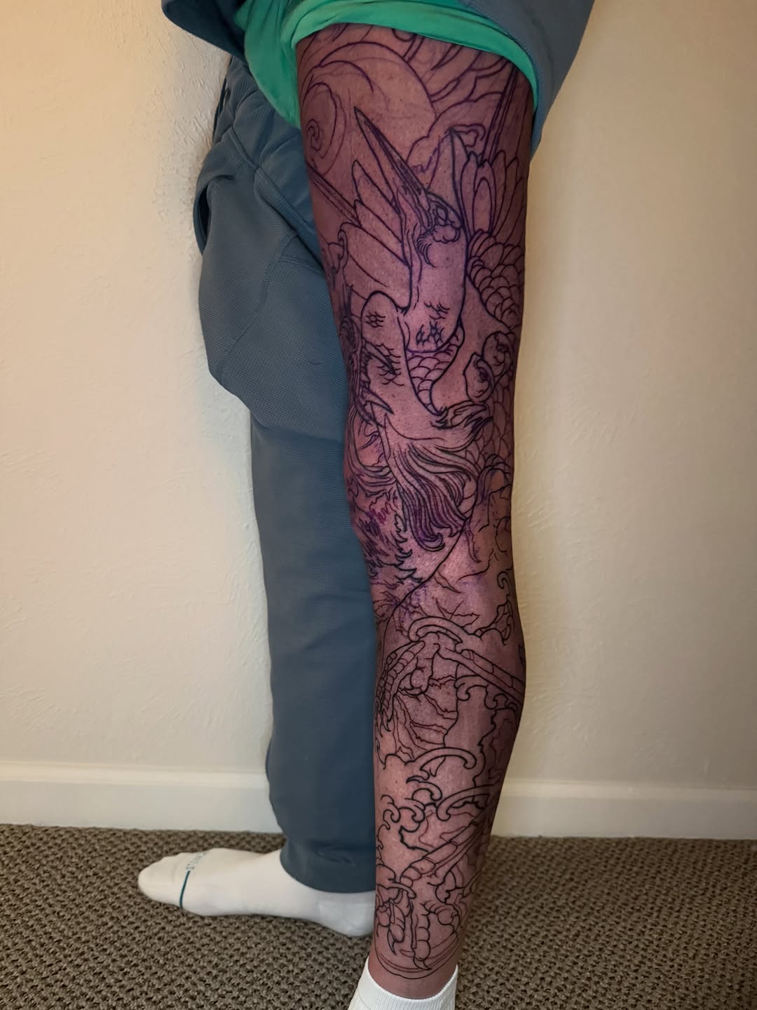Crane and waves Japanese tattoo on the leg by Mike Nance