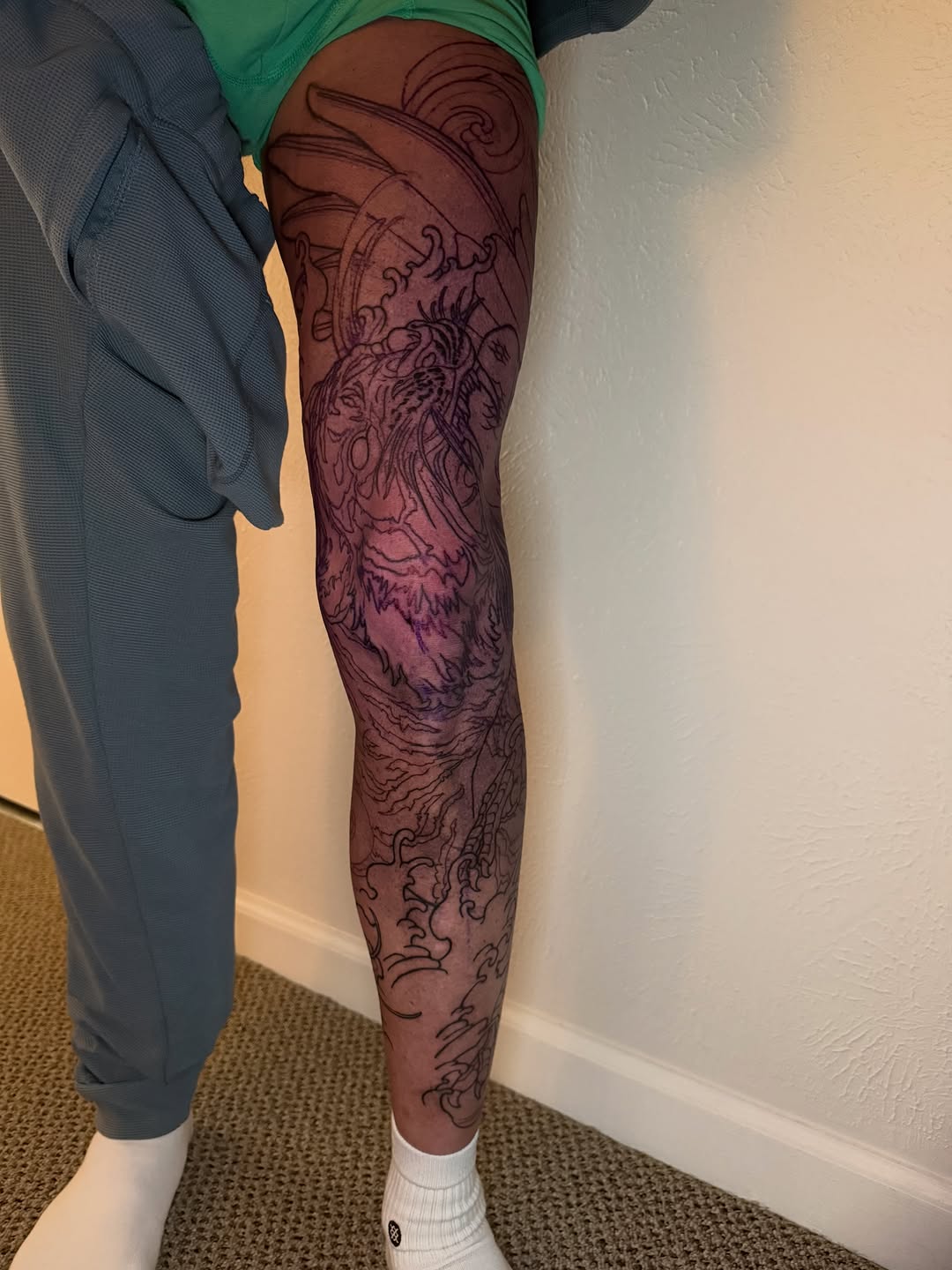 Dragon and waves Japanese tattoo on the leg by Mike Nance