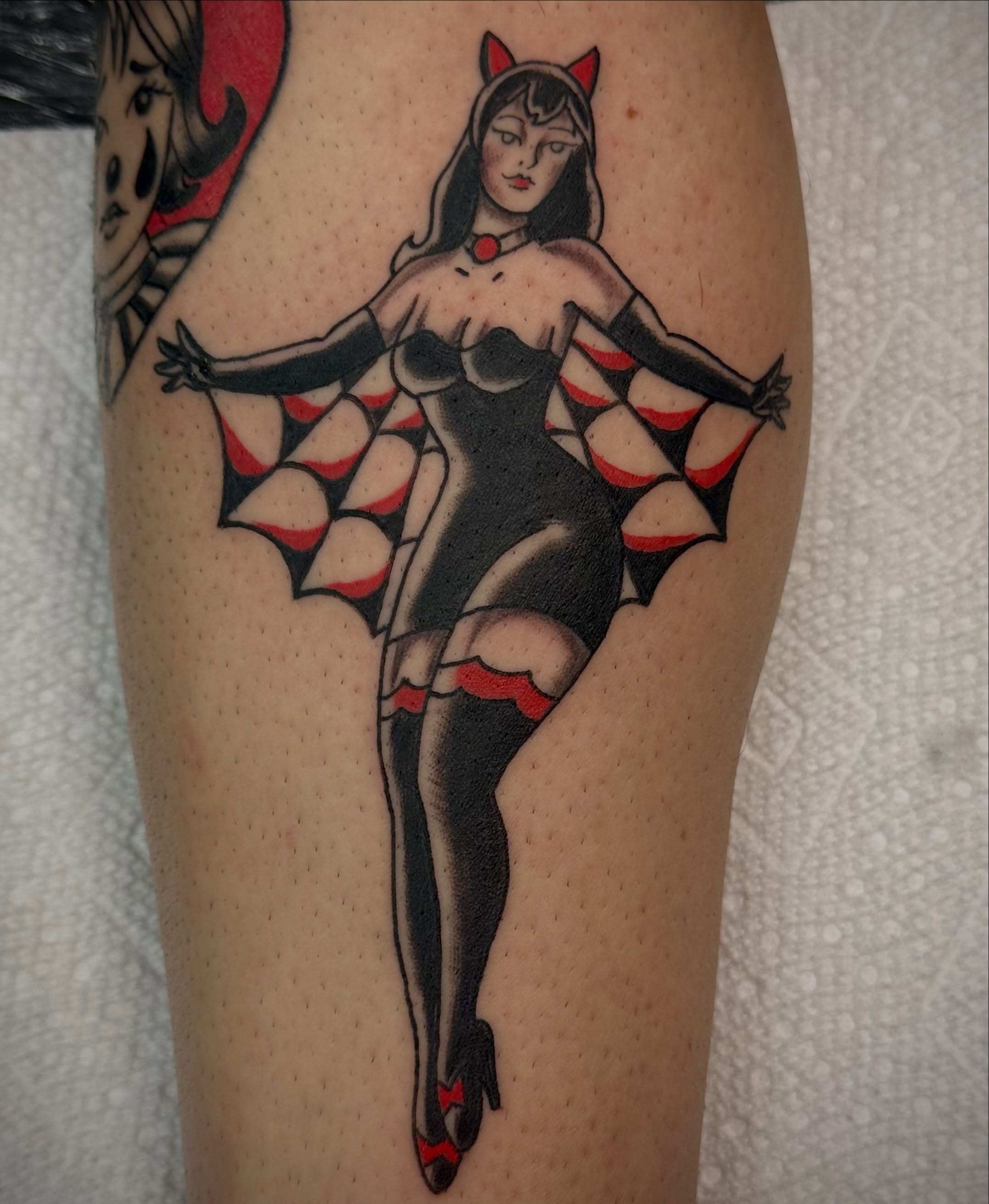 Batgirl American traditional tattoo on the thigh by Josh Robinson
