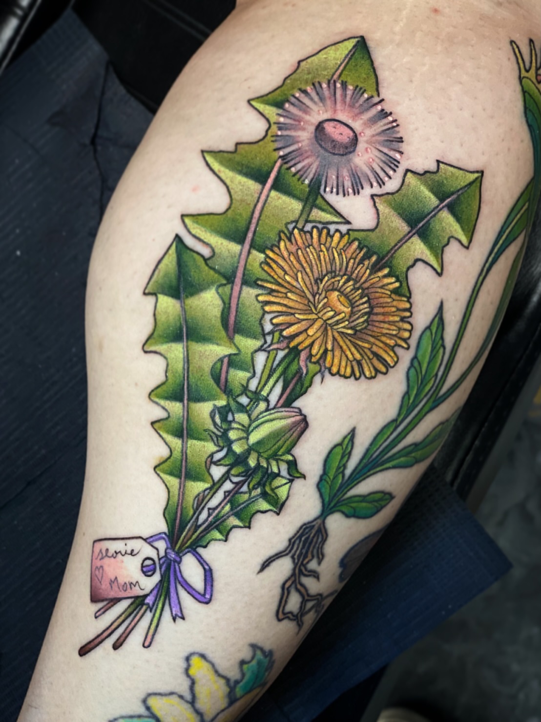 Dandelion realism tattoo on the upper arm by Seth Mullin, Hemet, California