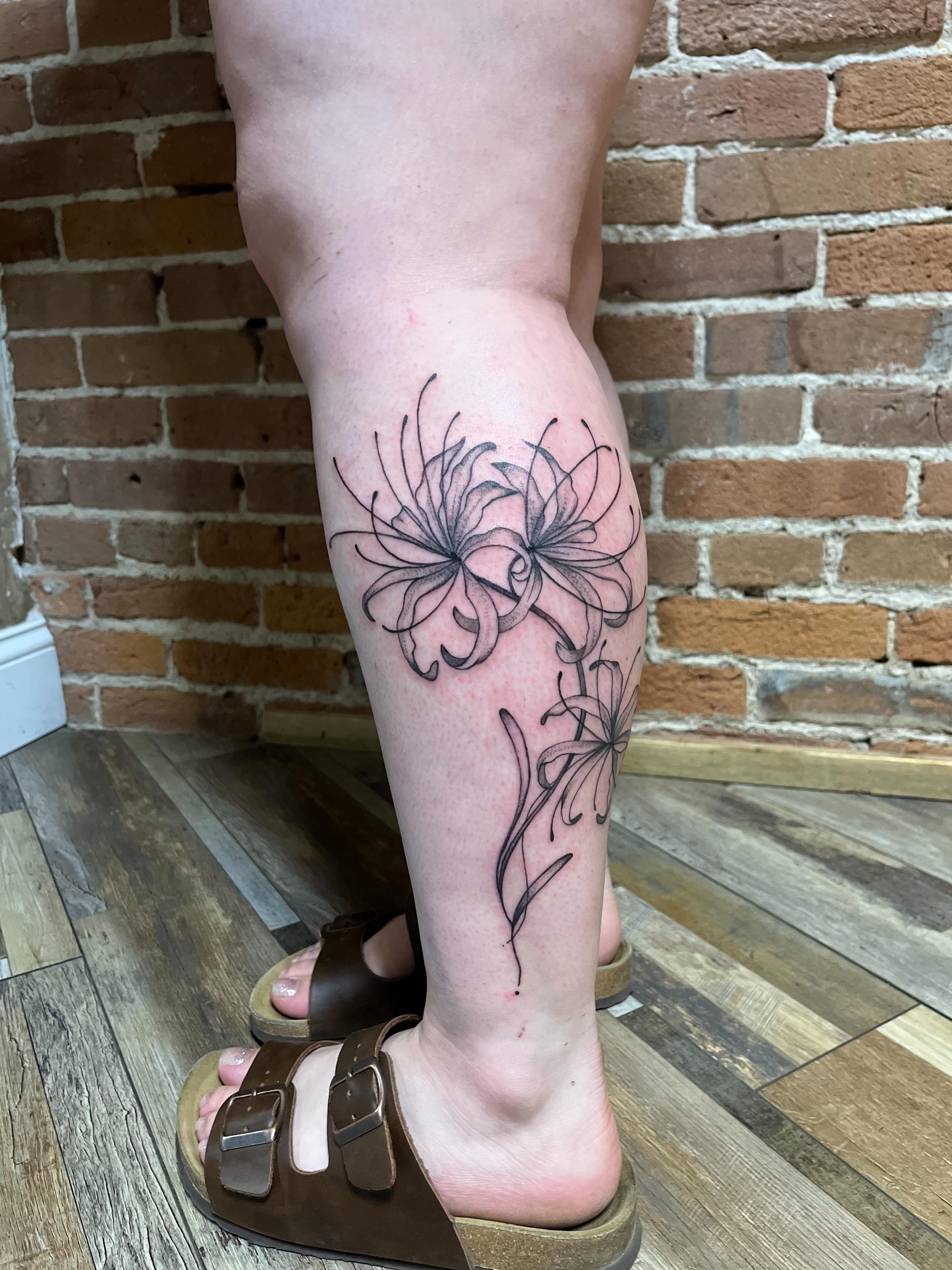Lilies black and grey tattoo on the calf by Tattoo Artist, Kansas City, Missouri