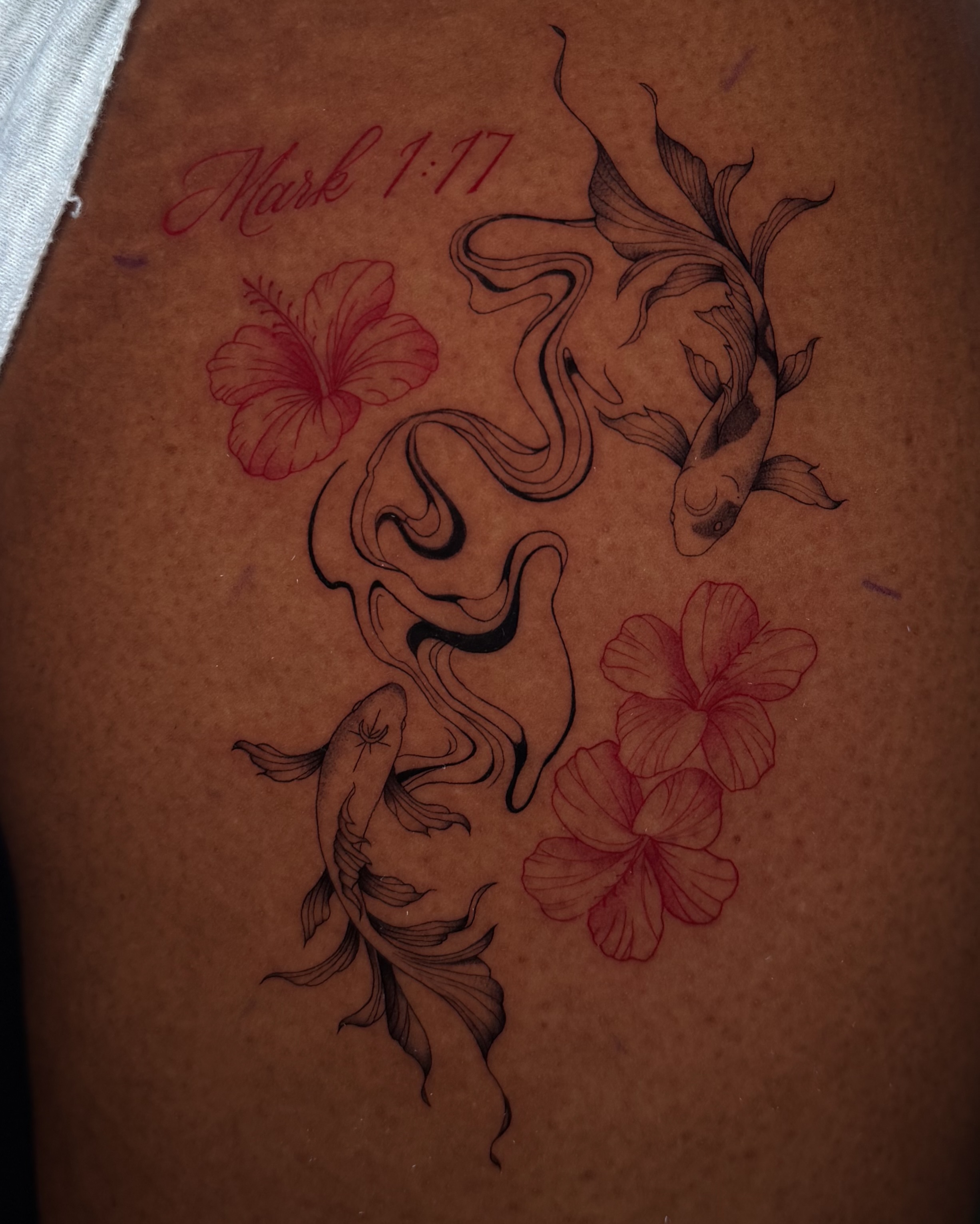Koi fish and hibiscus flowers black and grey tattoo on the thigh by Marianne