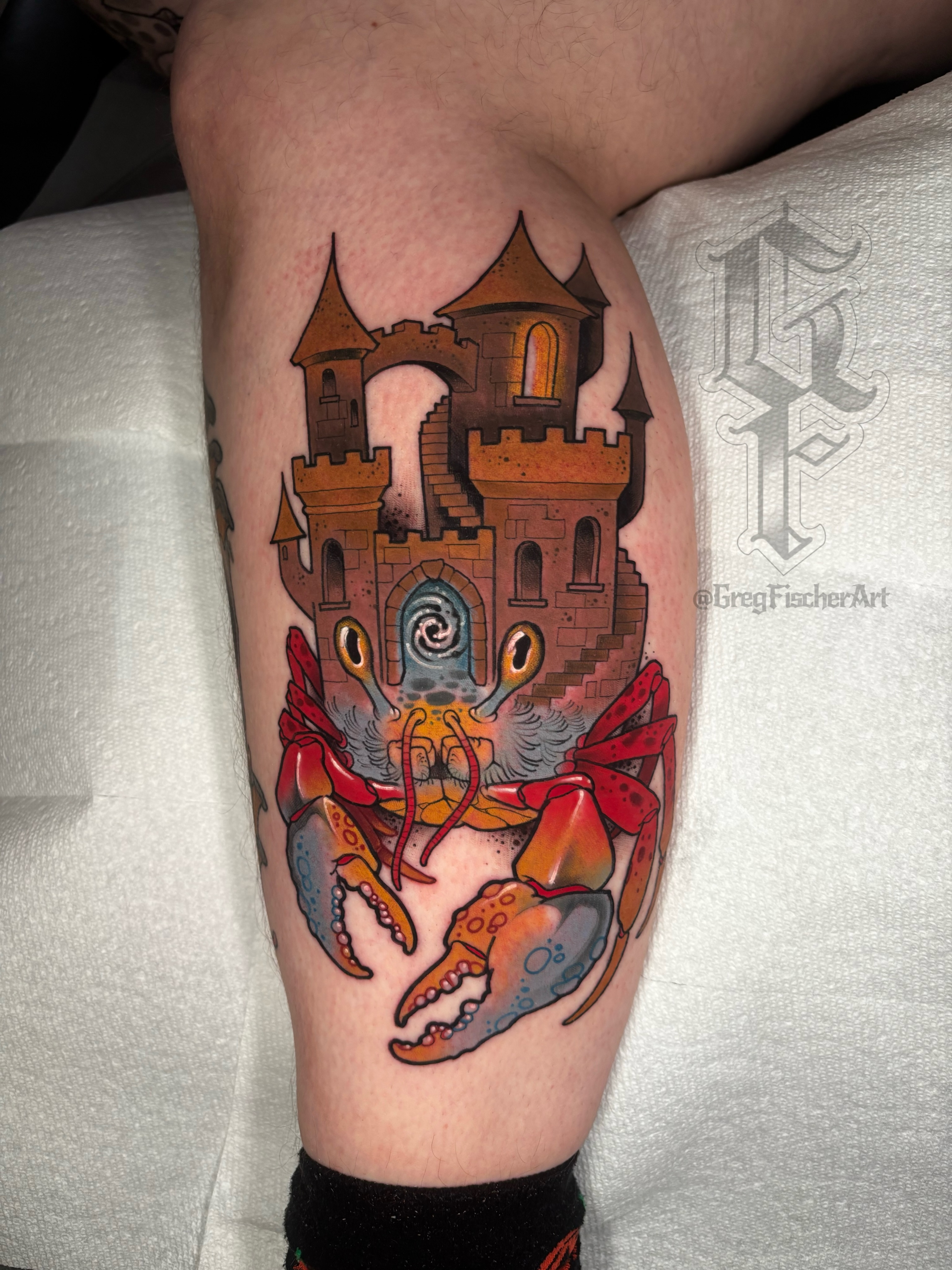 Castle and crab American traditional tattoo on the thigh by Greg Fischer