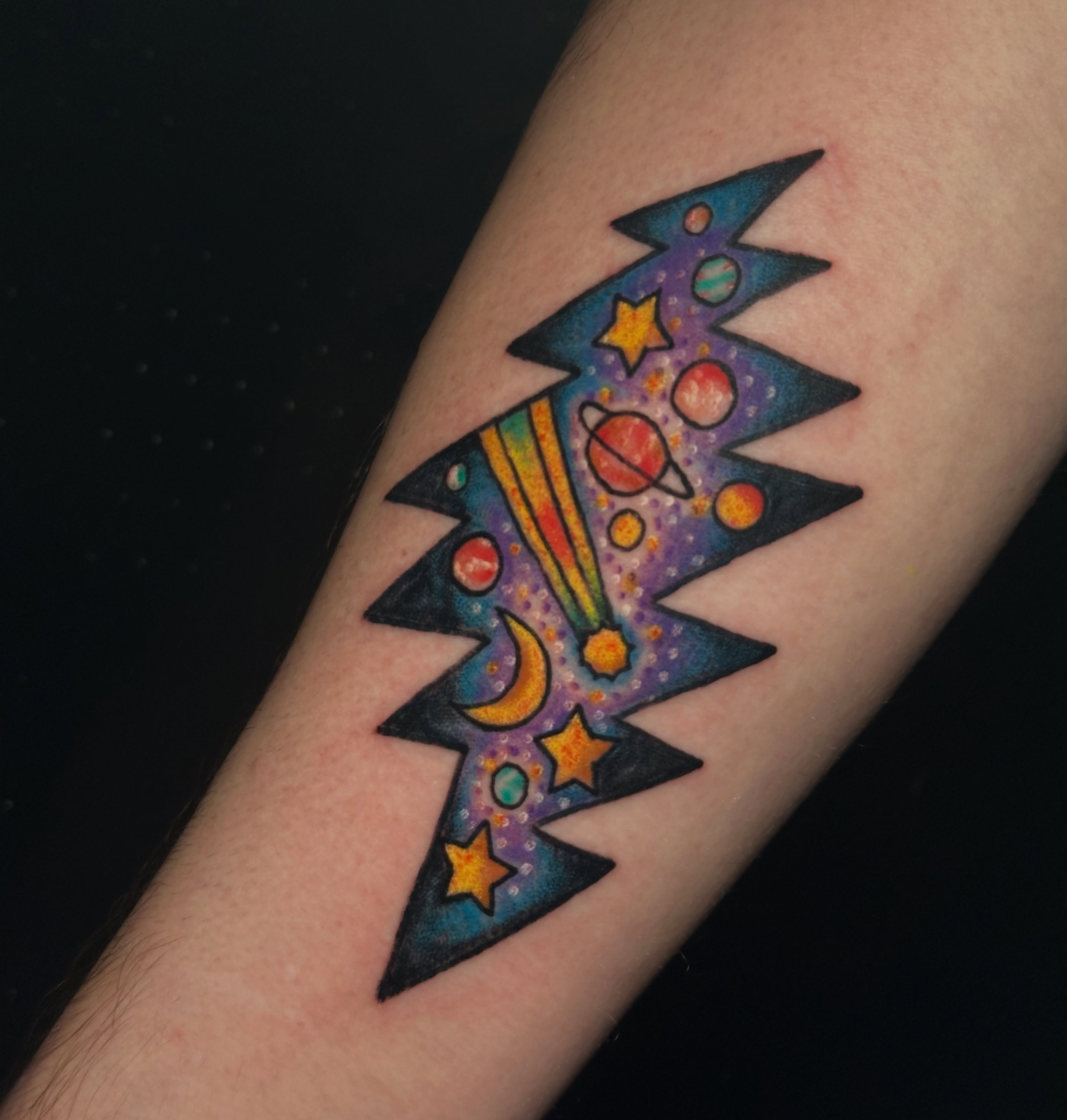 Space-themed rocket geometric tattoo on the forearm by Providence Tattooer