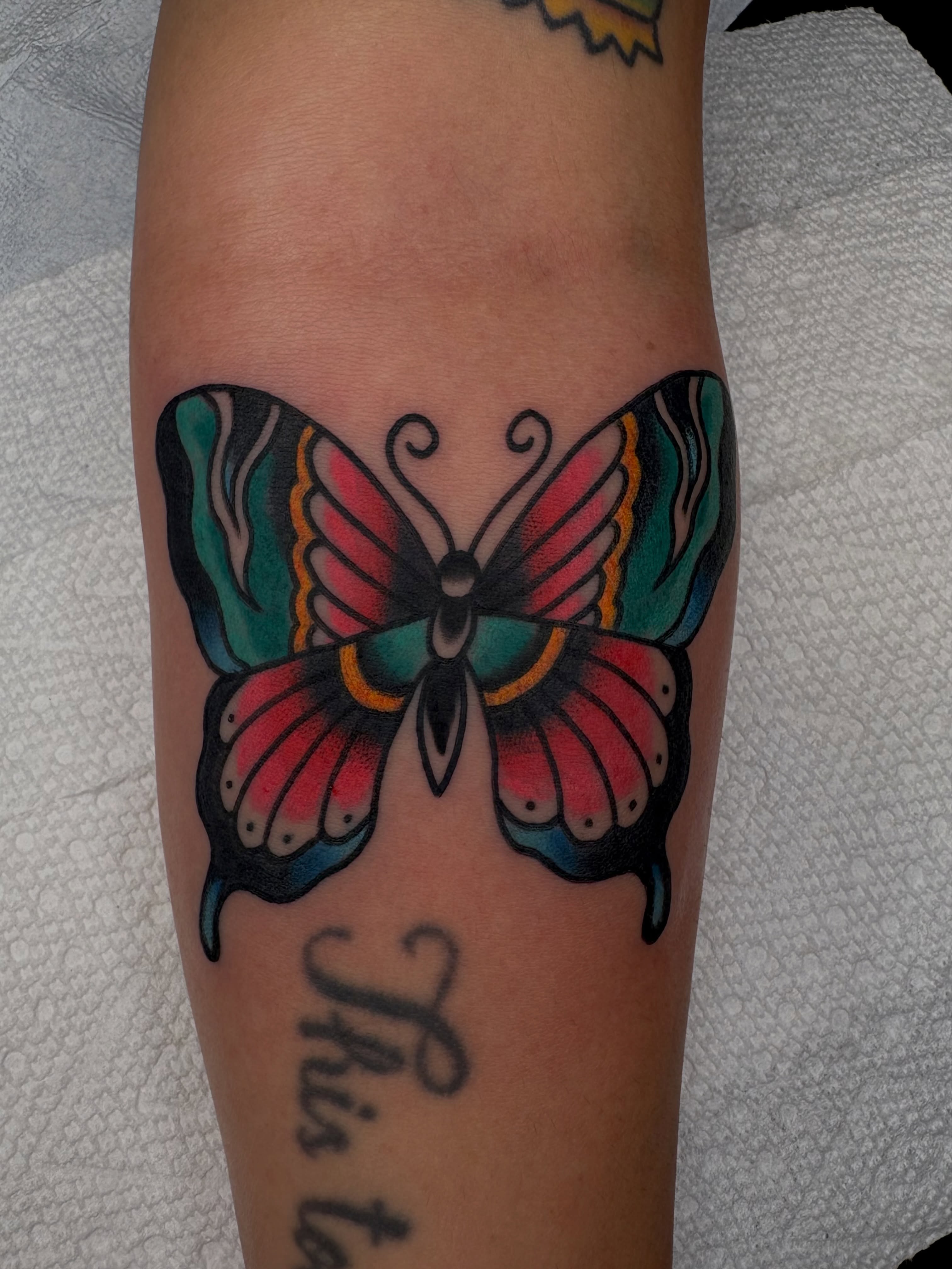 Butterfly American traditional tattoo on the forearm by Dallas Tattoo Artist