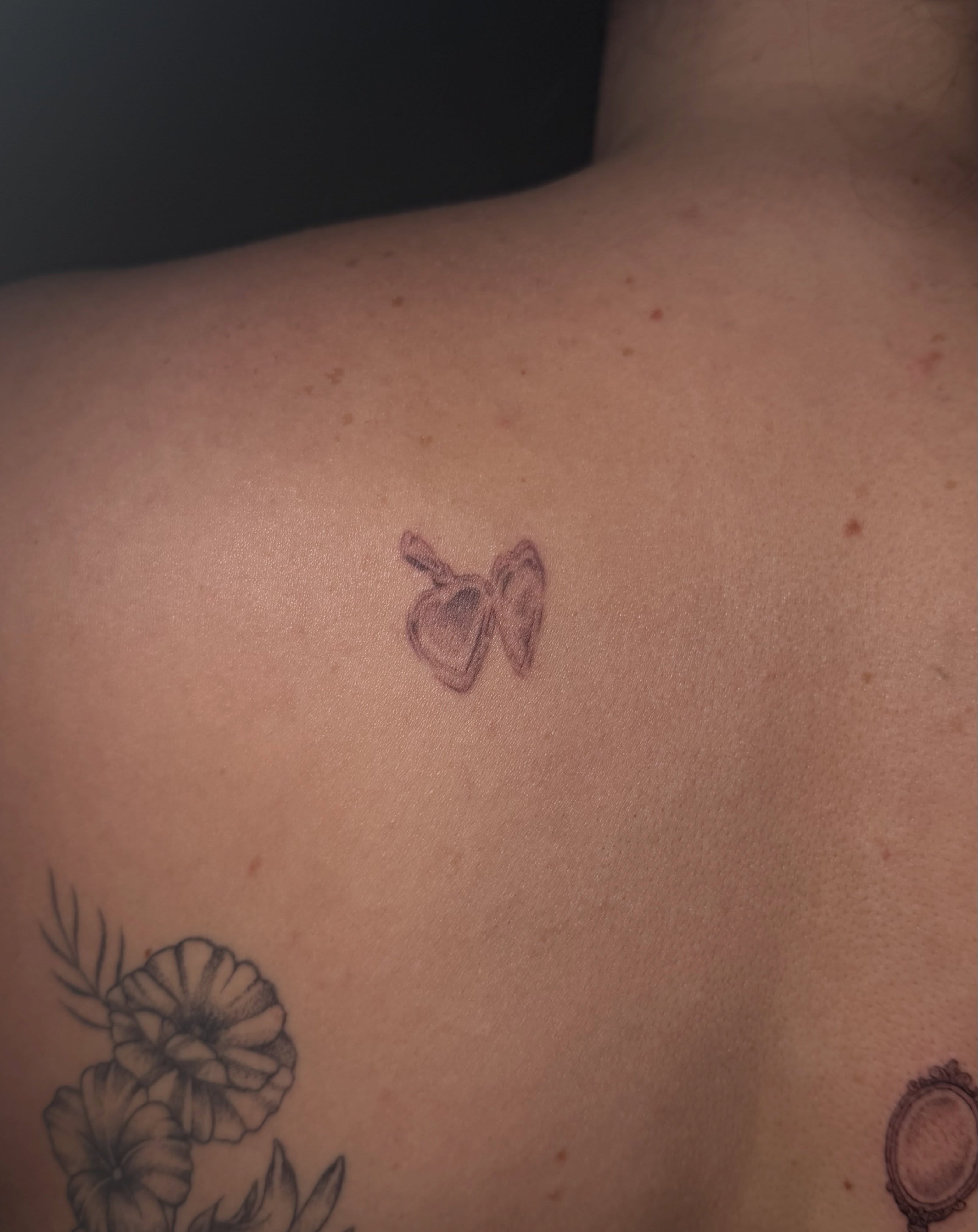 Open heart black and grey tattoo on the back by Ink Darling, Carlisle, Iowa