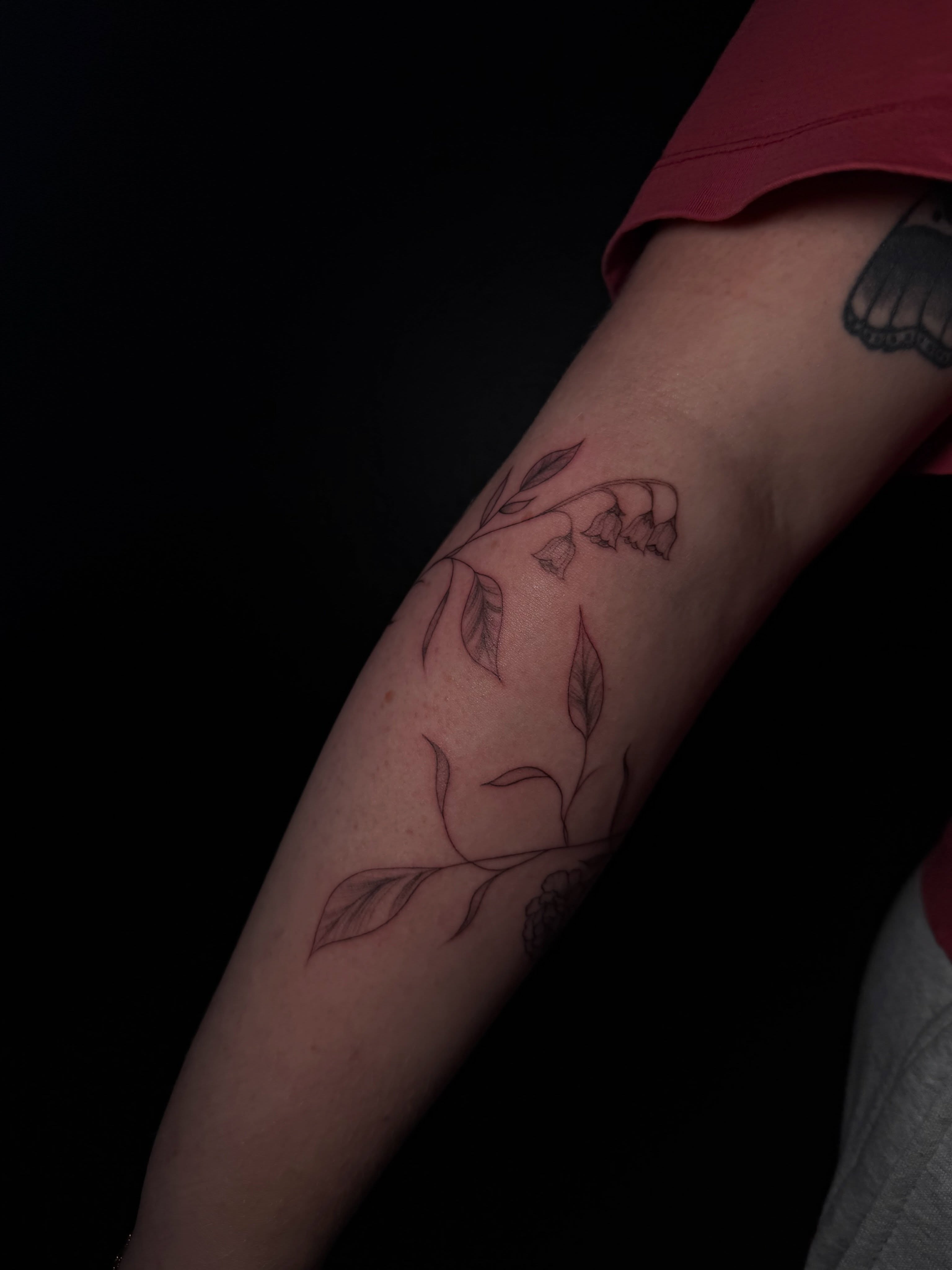 Lily of the valley fine line tattoo on the forearm by Ink Darling, Carlisle, Iowa