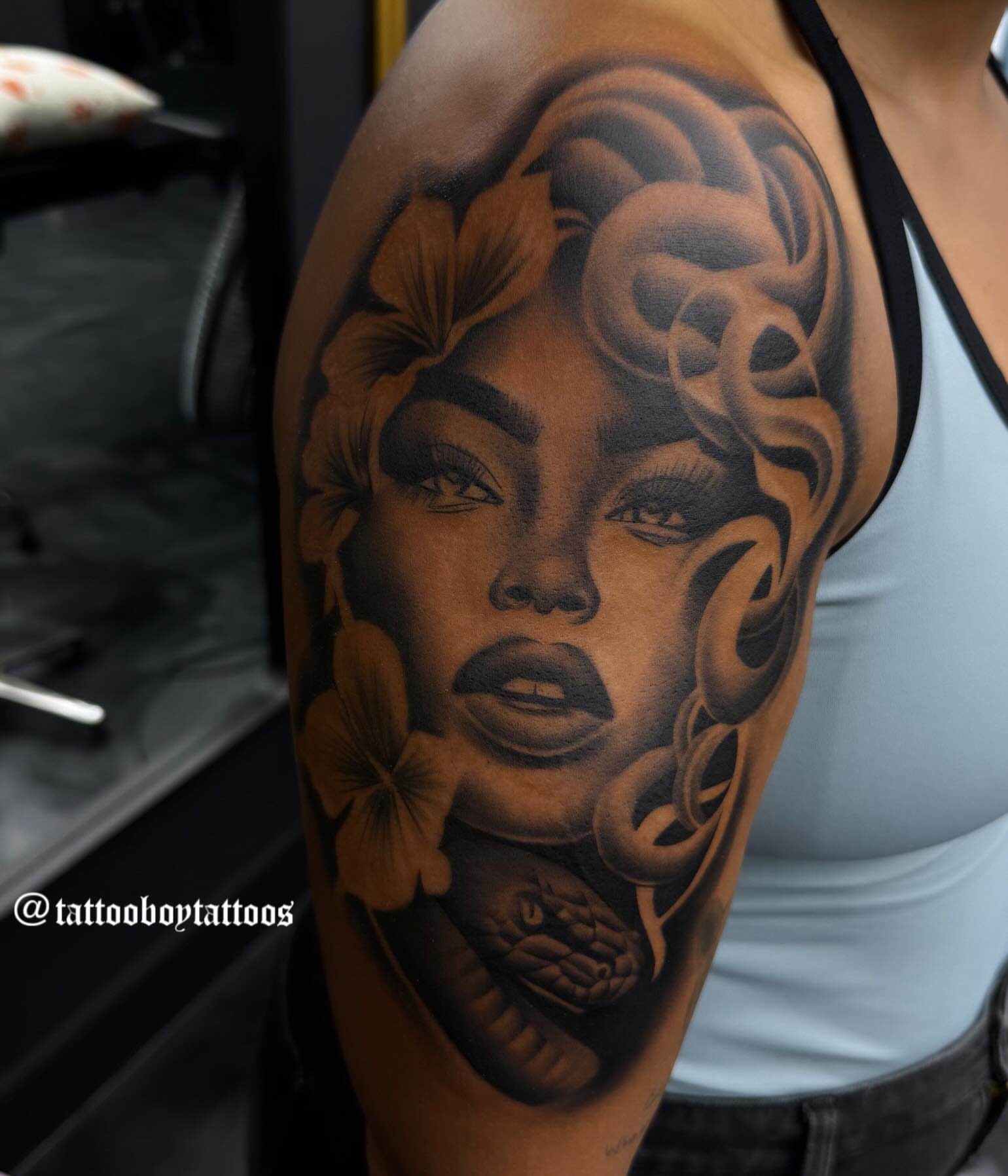 Woman's face realism tattoo on the shoulder by TattooBoyTattoos