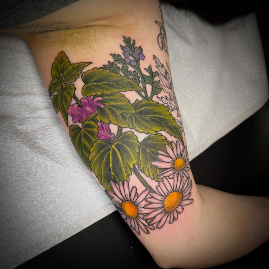 Flowers and leaves realism tattoo on the forearm by Tattoos by Alex
