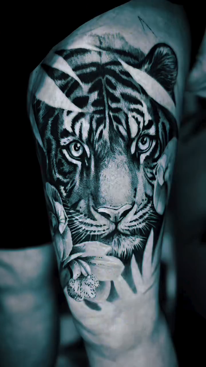 Tiger and flowers realism tattoo by Sam Minter, Grafton, Massachusetts