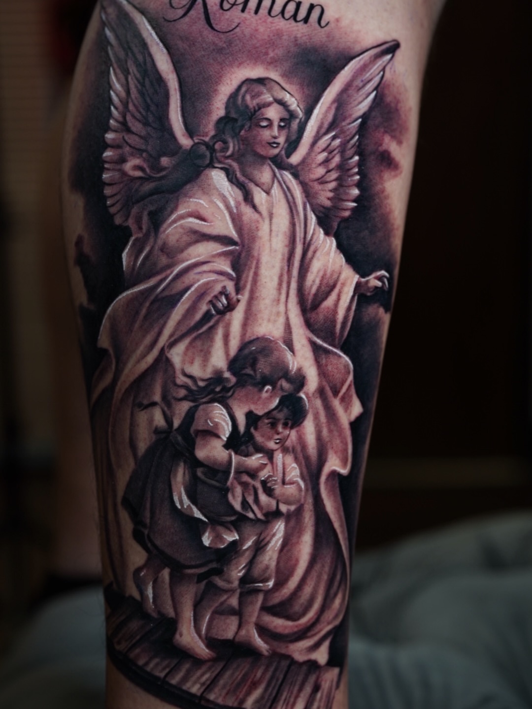 Angel with children realism tattoo on the forearm by Luis Rodriguez