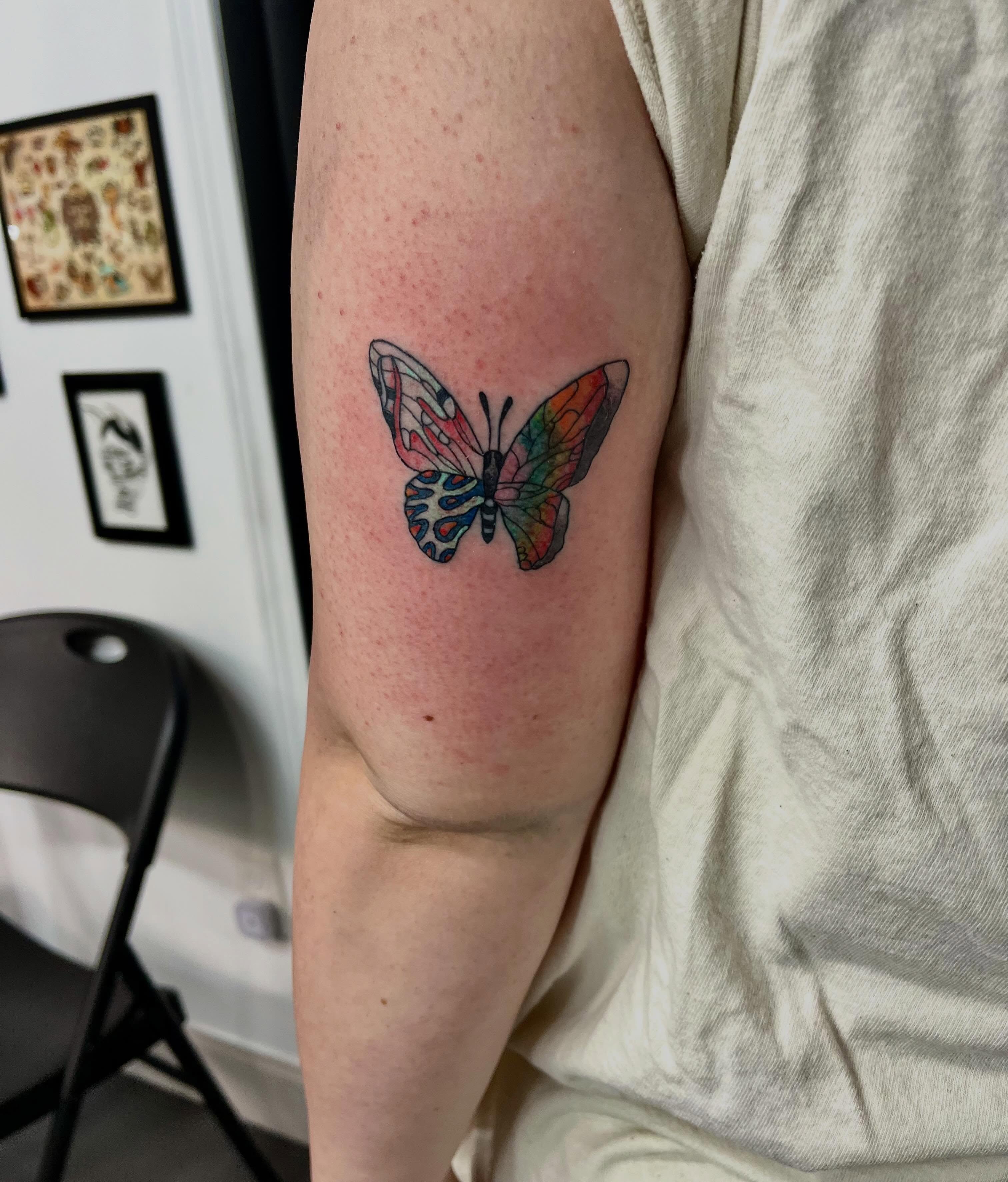 Butterfly new school tattoo on the forearm by Mason McCubbin
