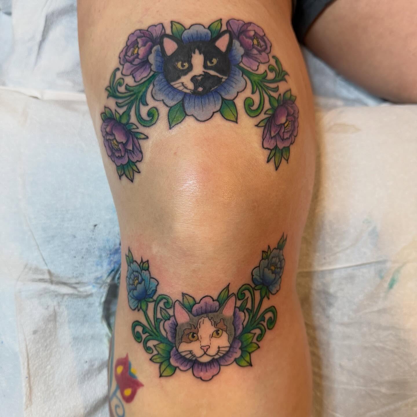Cat and floral wreath American traditional tattoo on the forearm by Krystal Harris