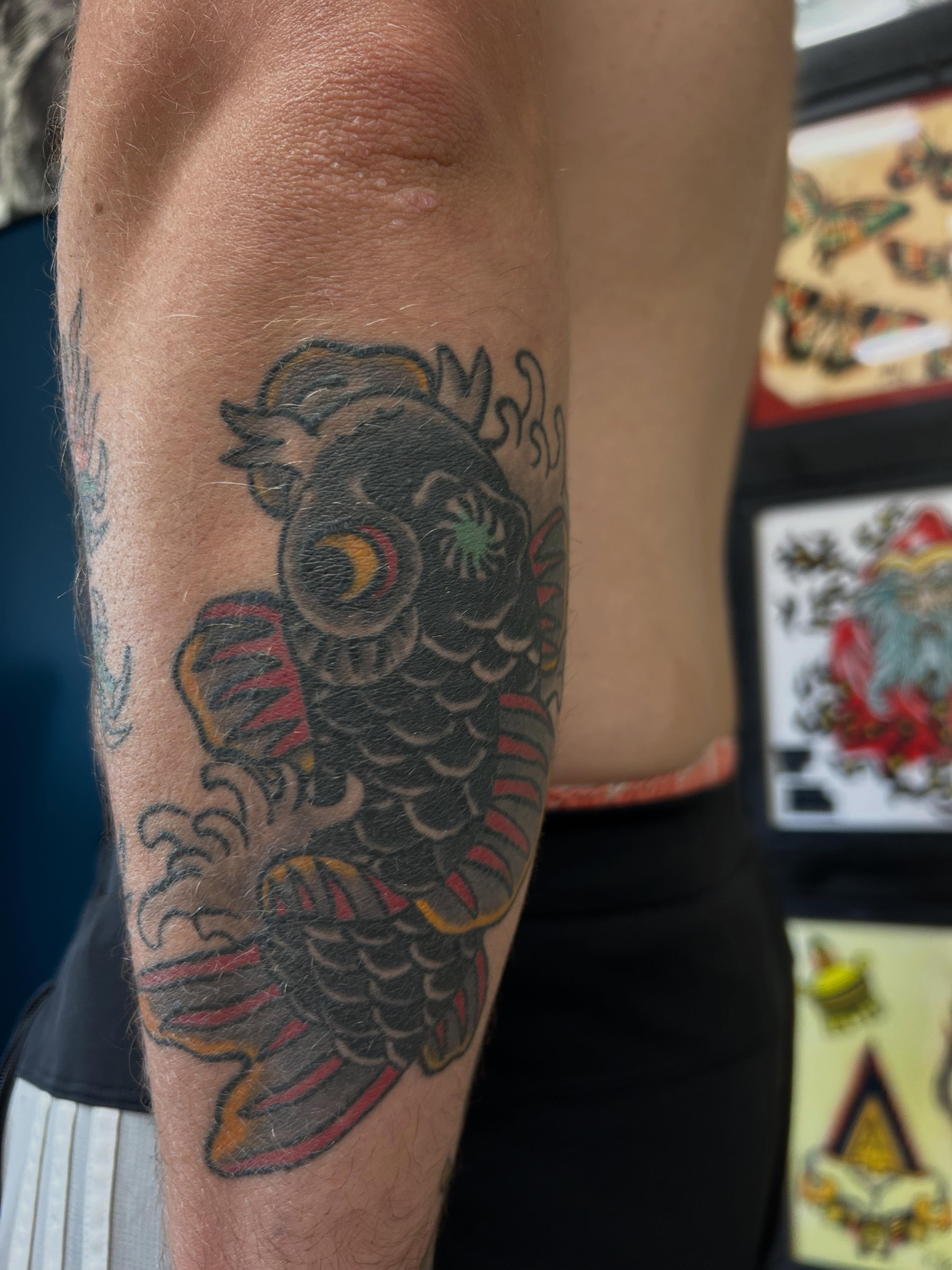 Koi fish American traditional tattoo on the forearm by Stogie Tony