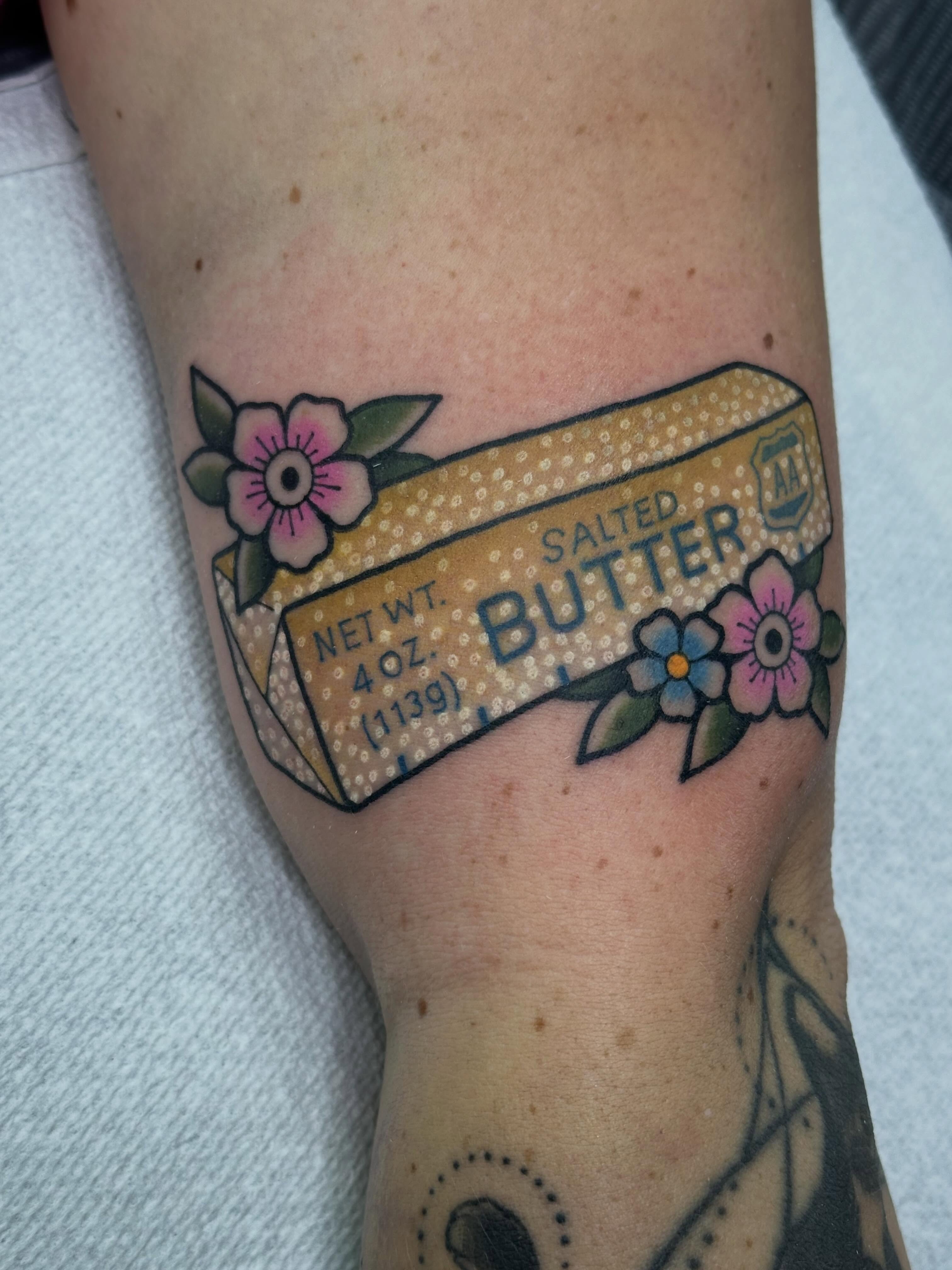 Salted butter box American traditional tattoo on the forearm by Ginny Marie Kalnasy