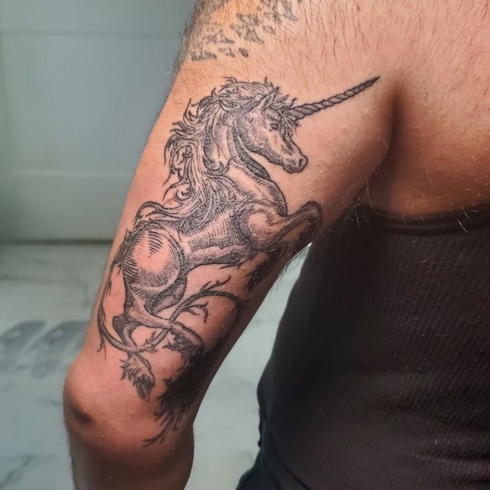 Unicorn black and grey tattoo on the forearm by Matthew Ray, Harrisburg, North Carolina