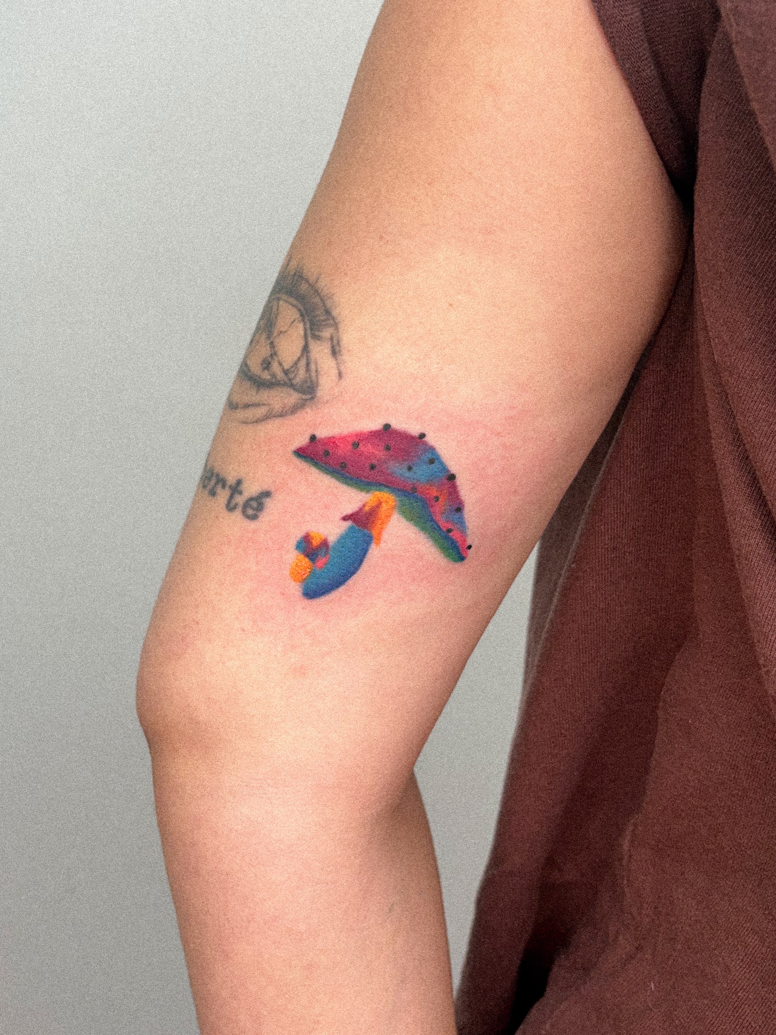 Dolphin and jellyfish dotwork tattoo on the forearm by júlia sanches ✦︎