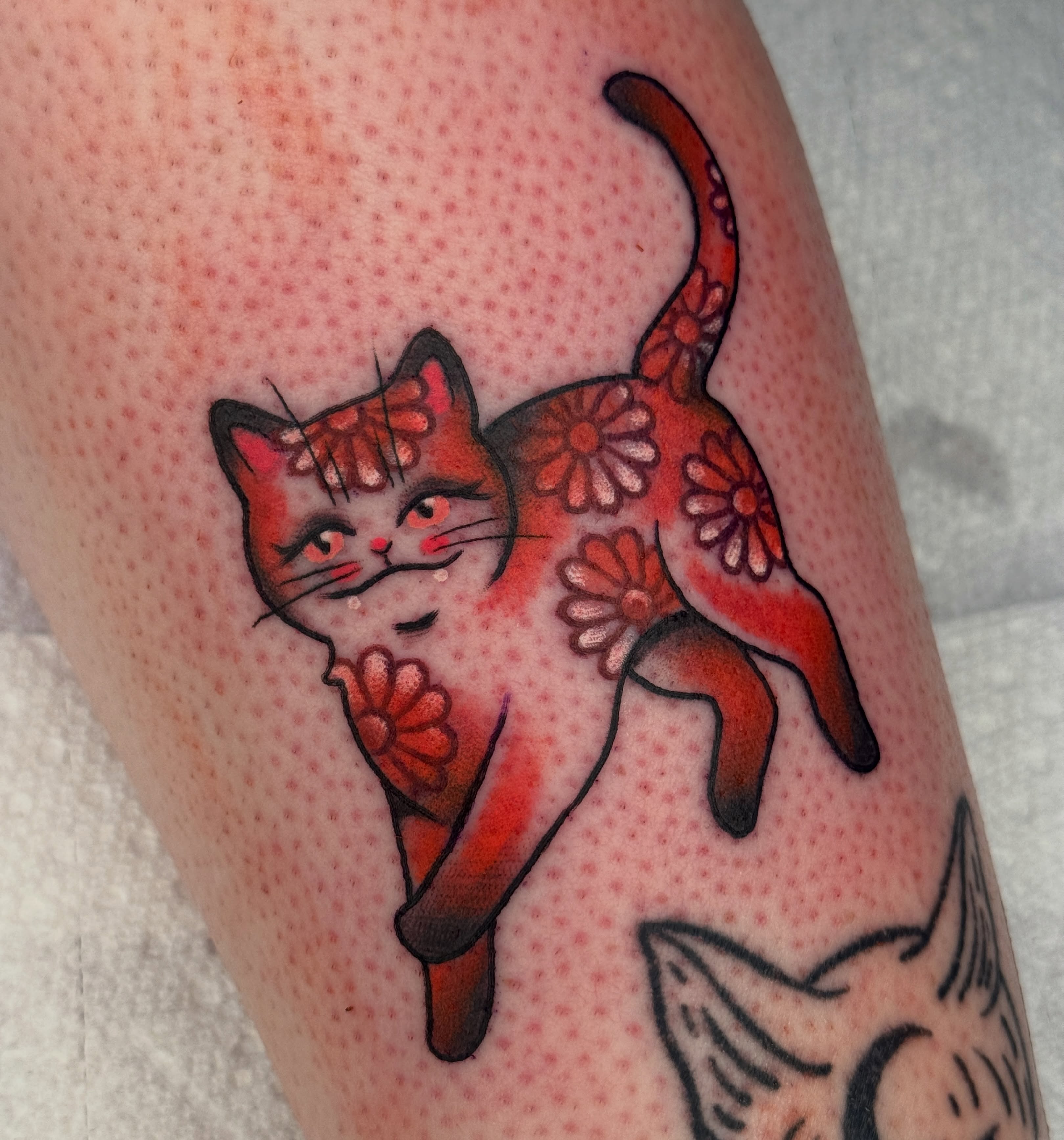 Cat dotwork tattoo on the thigh by Tattoos by Angel Lee